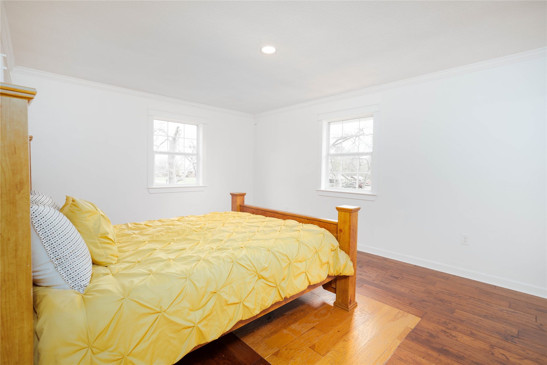 1635 Pony Lane, Wallis, TX 77485 Bedroom Suite Bright and inviting bedroom featuring warm hardwood floors, crisp white trim, and multiple windows that bring in abundant natural light. 2 closets (including a walk-in closet) and spacious en-suite bathroom.