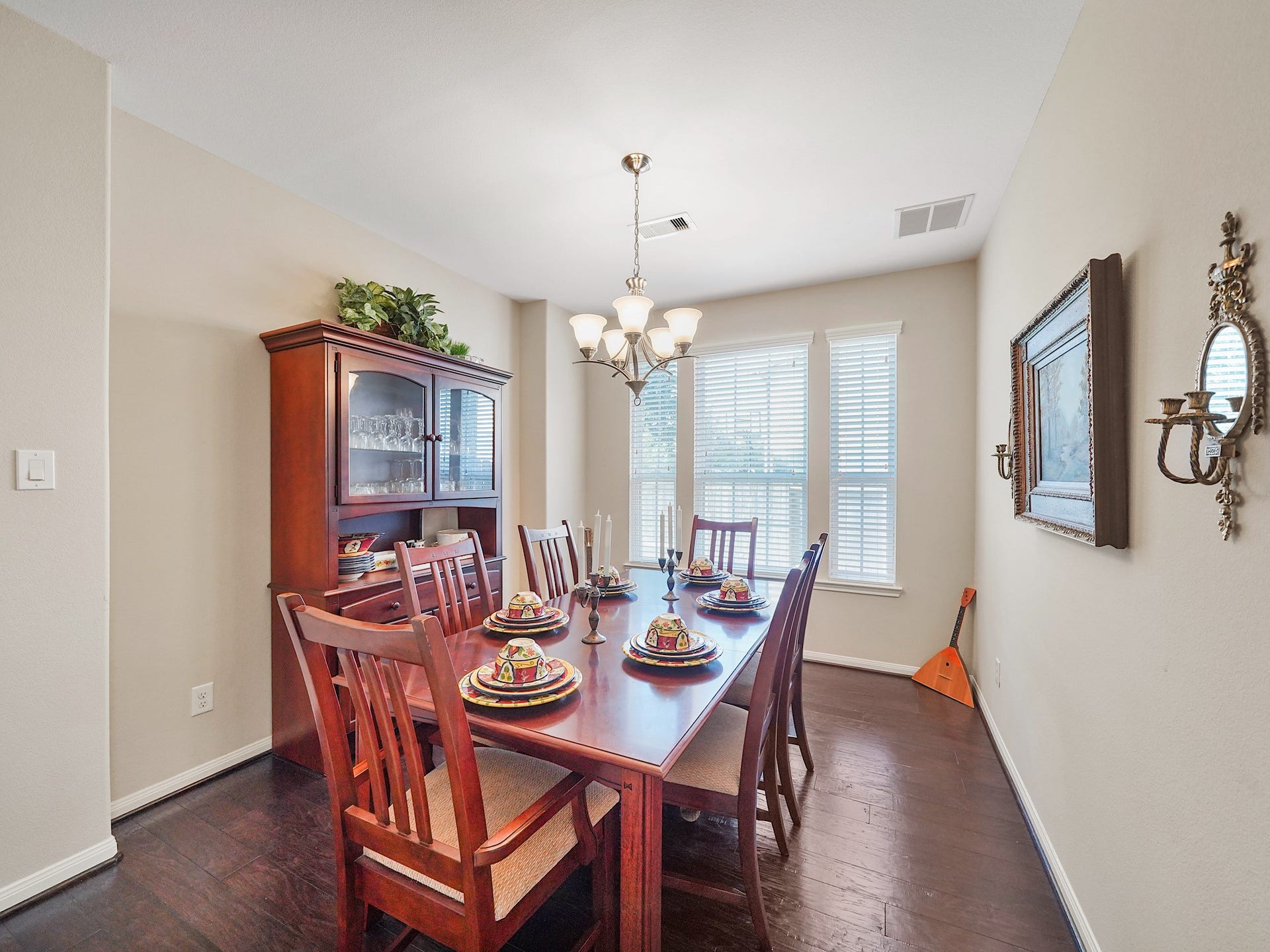 3250 Bandera Run Lane, Katy, TX 77494 Rich wood flooring and natural light from the large windows bring warmth to the dining room, while a chandelier adds a touch of elegance. Its an inviting setting for intimate dinners, holiday gatherings, and celebrations with those you love.