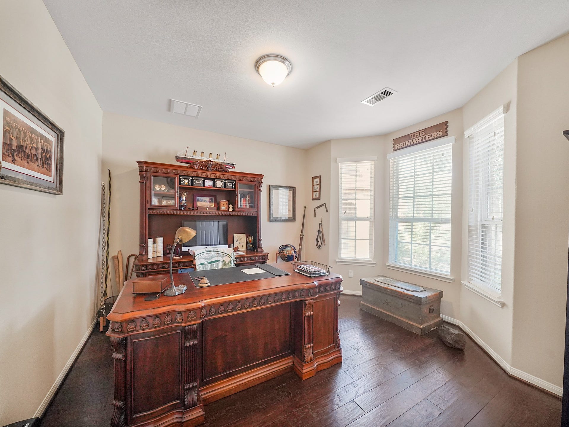 3250 Bandera Run Lane, Katy, TX 77494 Discover the perfect blend of elegance and functionality in this private office, featuring rich wood flooring and ample natural light for an inspiring workspace.
