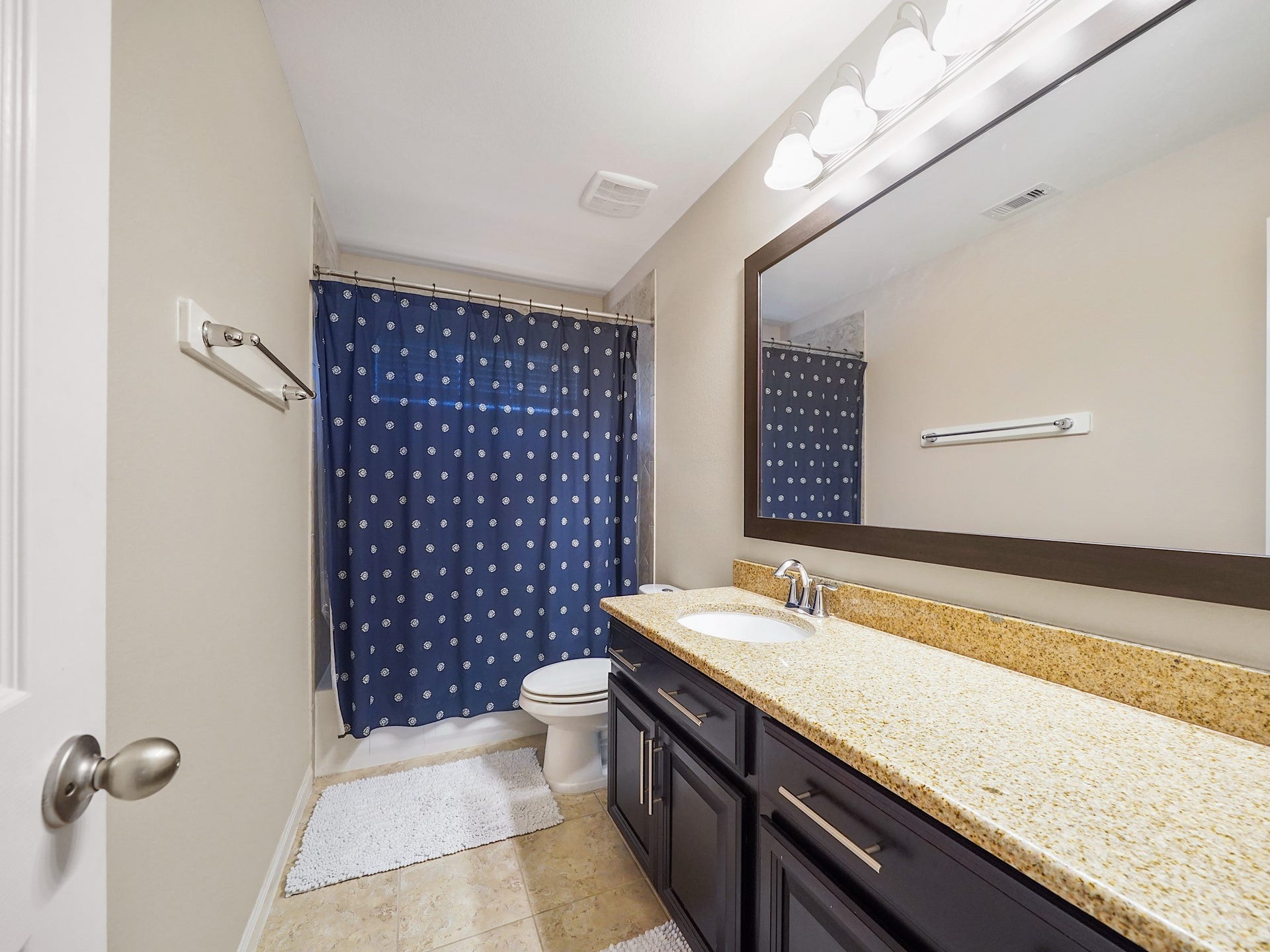 3250 Bandera Run Lane, Katy, TX 77494 The upstairs secondary bathroom features an extended vanity with extra storage to keep everyday essentials organized and within reach. A tub and shower combination adds versatility for busy mornings and relaxing evenings alike.