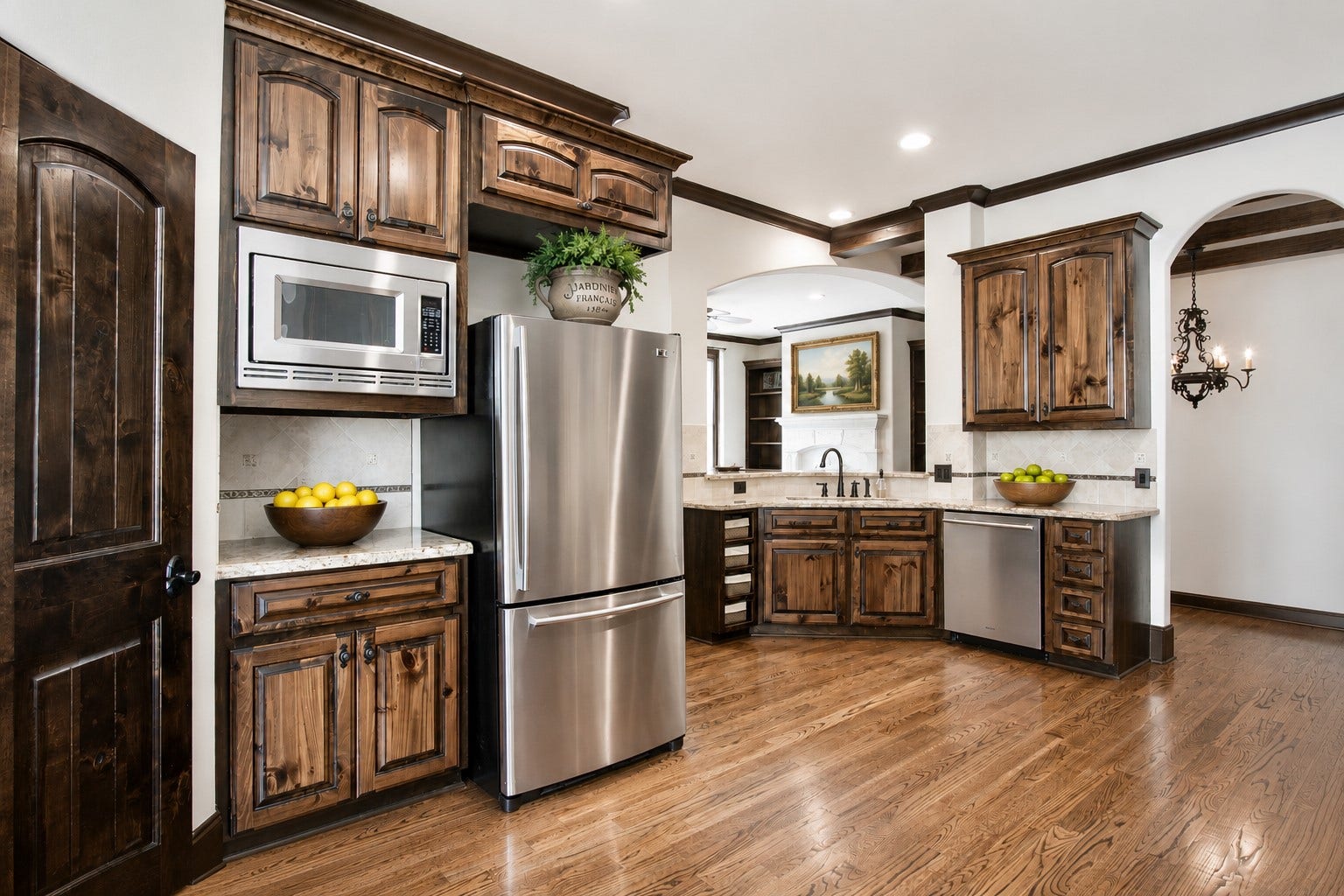 1241 W 24th Street, #C, Houston, TX 77008 Large kitchen with tons of storage. Solid wood knotty alder wood pantry door. Custom solid wood, site built cabinets.