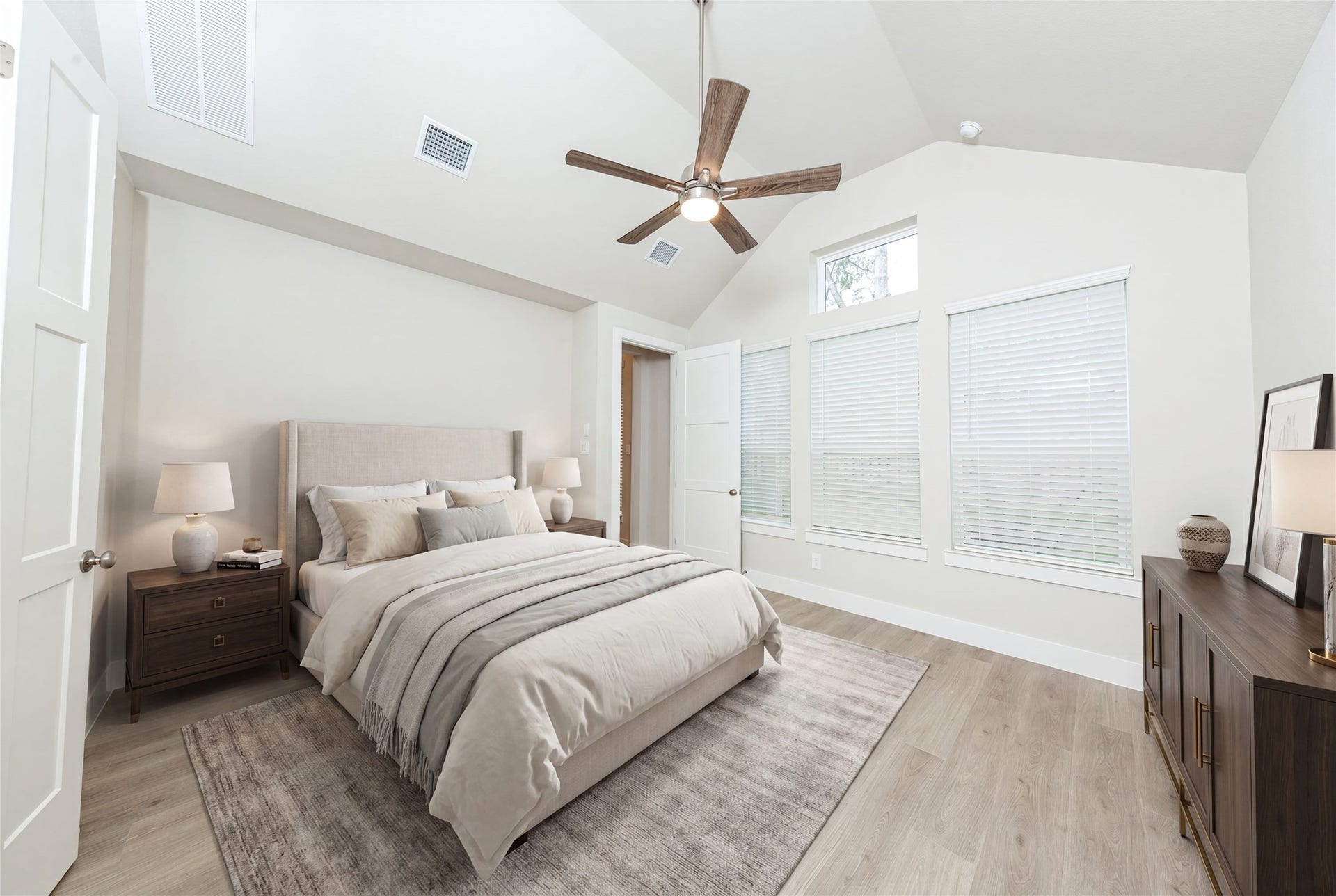 41422 Threadgill Way, Montgomery, TX 77316 This spacious primary bedroom features an eye-catching architectural niche that offers a dedicated, recessed area perfect for showcasing art, a reading nook, or extra decor, adding custom character without taking up valuable floor space. *Virtually Staged.