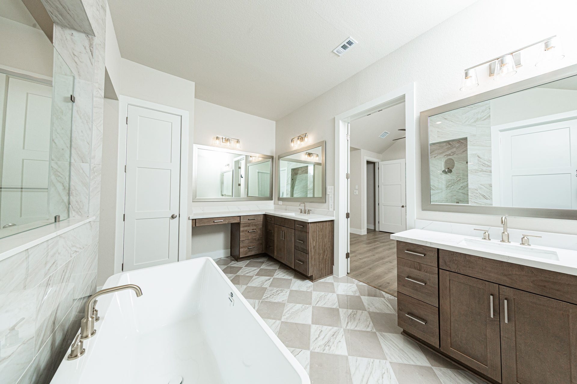 41422 Threadgill Way, Montgomery, TX 77316 Additional view of dual vanities which also includes another vanity with knee space, allowing for a comfortable, seated grooming experience.