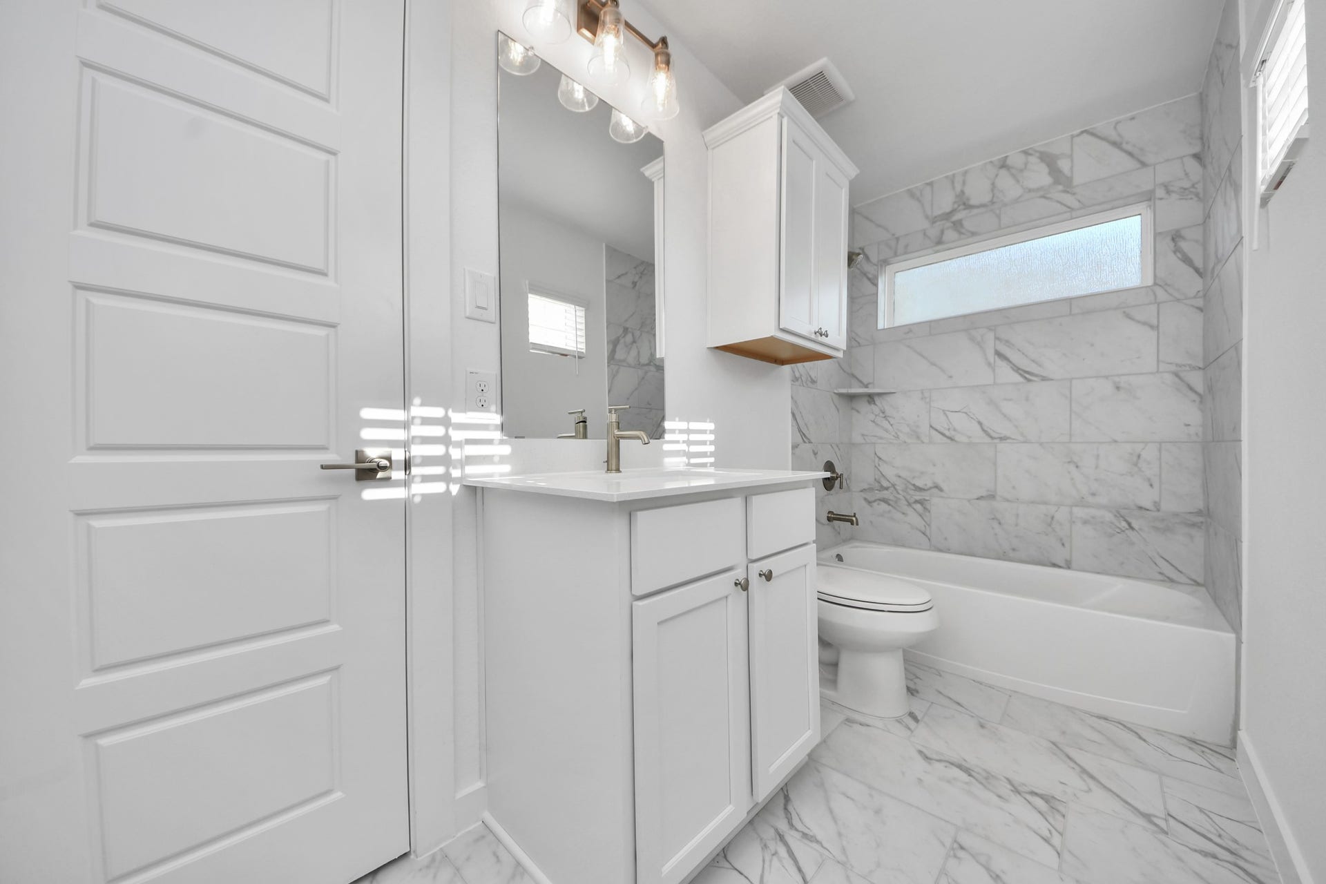 2097 Corn Thistle Way, Magnolia, TX 77355 Secondary bath features tile flooring, bath/shower combo with tile surround, light stained wood cabinets, beautiful light countertop.