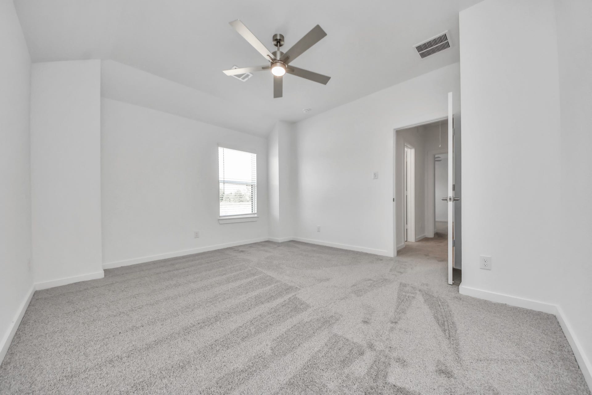 2097 Corn Thistle Way, Magnolia, TX 77355 Generously sized secondary bedrooms featuring spacious closets, soft and inviting carpeting underfoot, large windows allowing plenty of natural light, and the added touch of privacy blinds for your personal retreat.