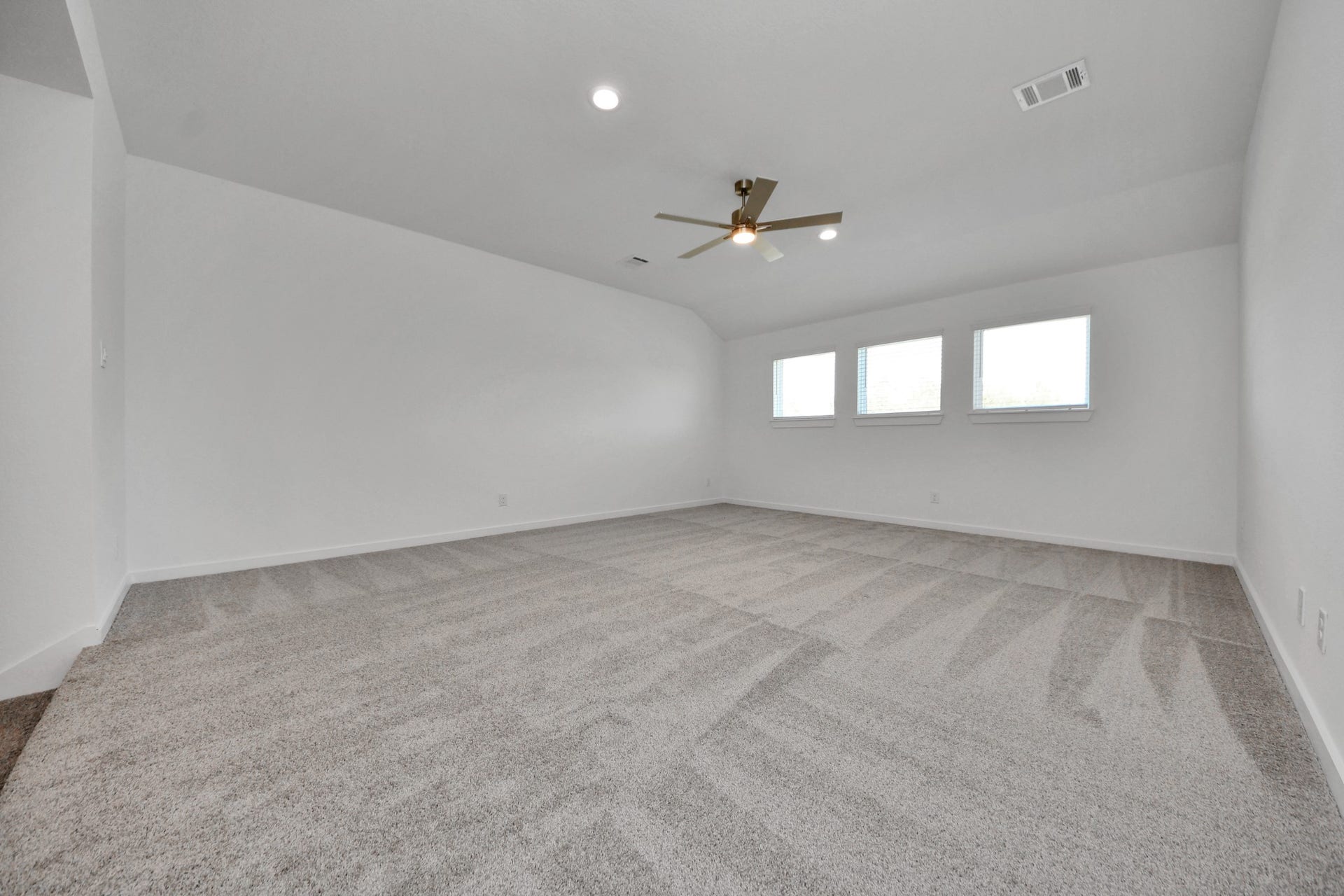 2097 Corn Thistle Way, Magnolia, TX 77355 Come upstairs and enjoy a day of leisure in this fabulous game room! This is the perfect hangout spot or adult game room! Features plush carpet, high ceilings, custom paint and windows for plenty of natural light.
