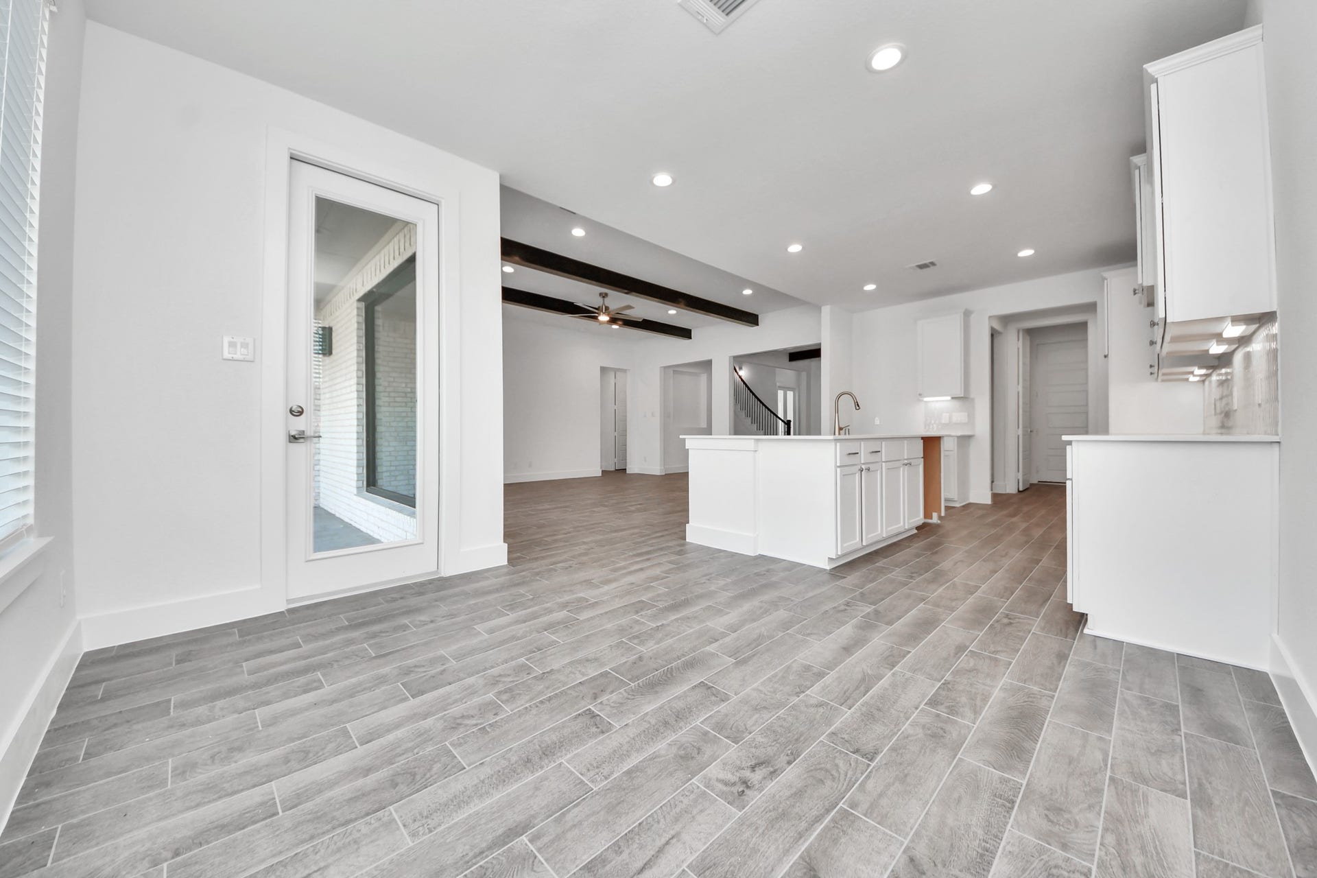 2097 Corn Thistle Way, Magnolia, TX 77355 Enjoy breakfast with ease in the connected and cozy breakfast area, seamlessly integrated with the kitchen for utmost convenience. Step through the back door for a breath of fresh air onto the covered patio, extending your living space to the outdoors