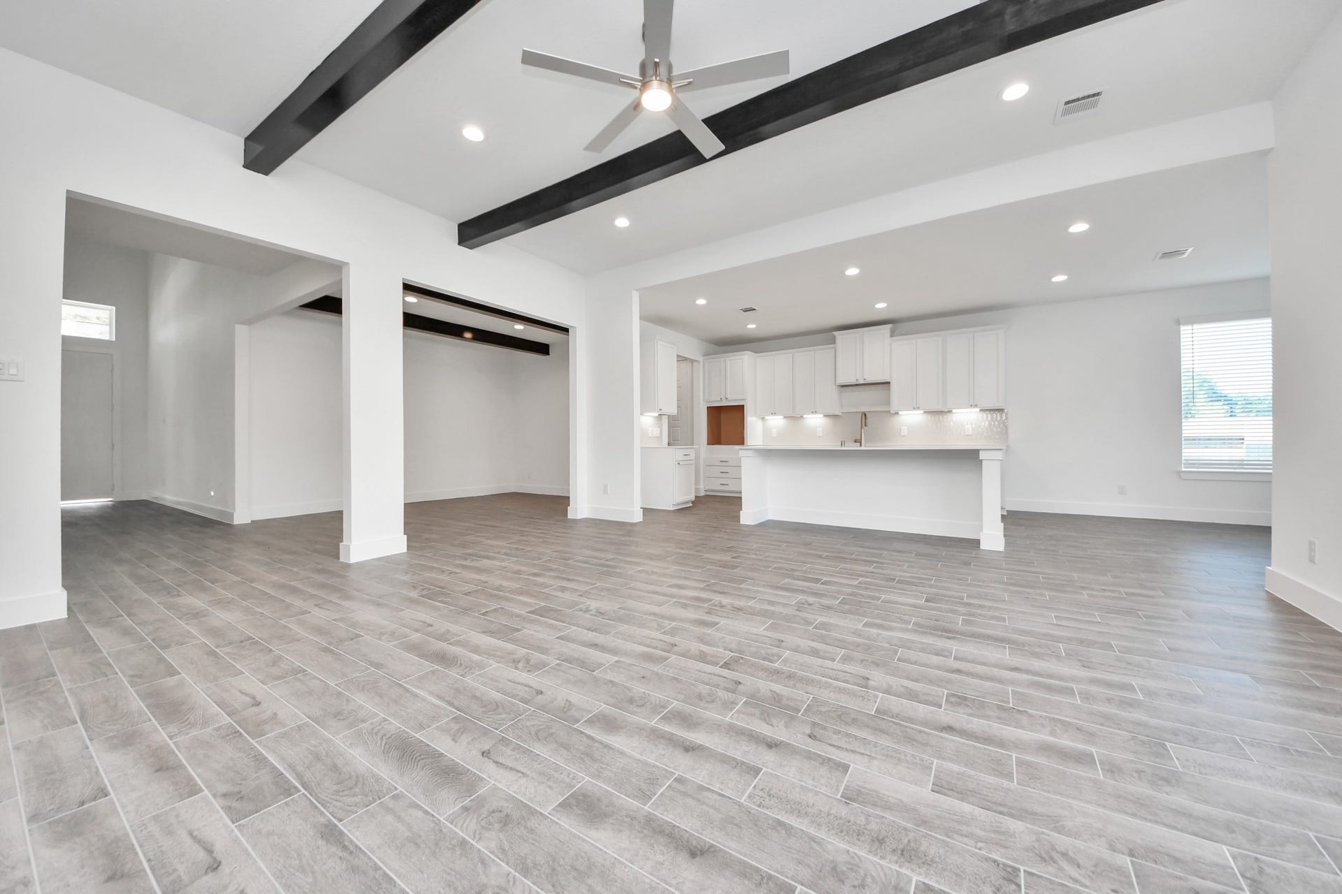 2097 Corn Thistle Way, Magnolia, TX 77355 Gather the family and guests together in your lovely living room! Featuring soaring high ceilings, recessed lighting, ceiling fan, custom paint, gorgeous floors, and large windows that provide plenty of natural lighting throughout the day.