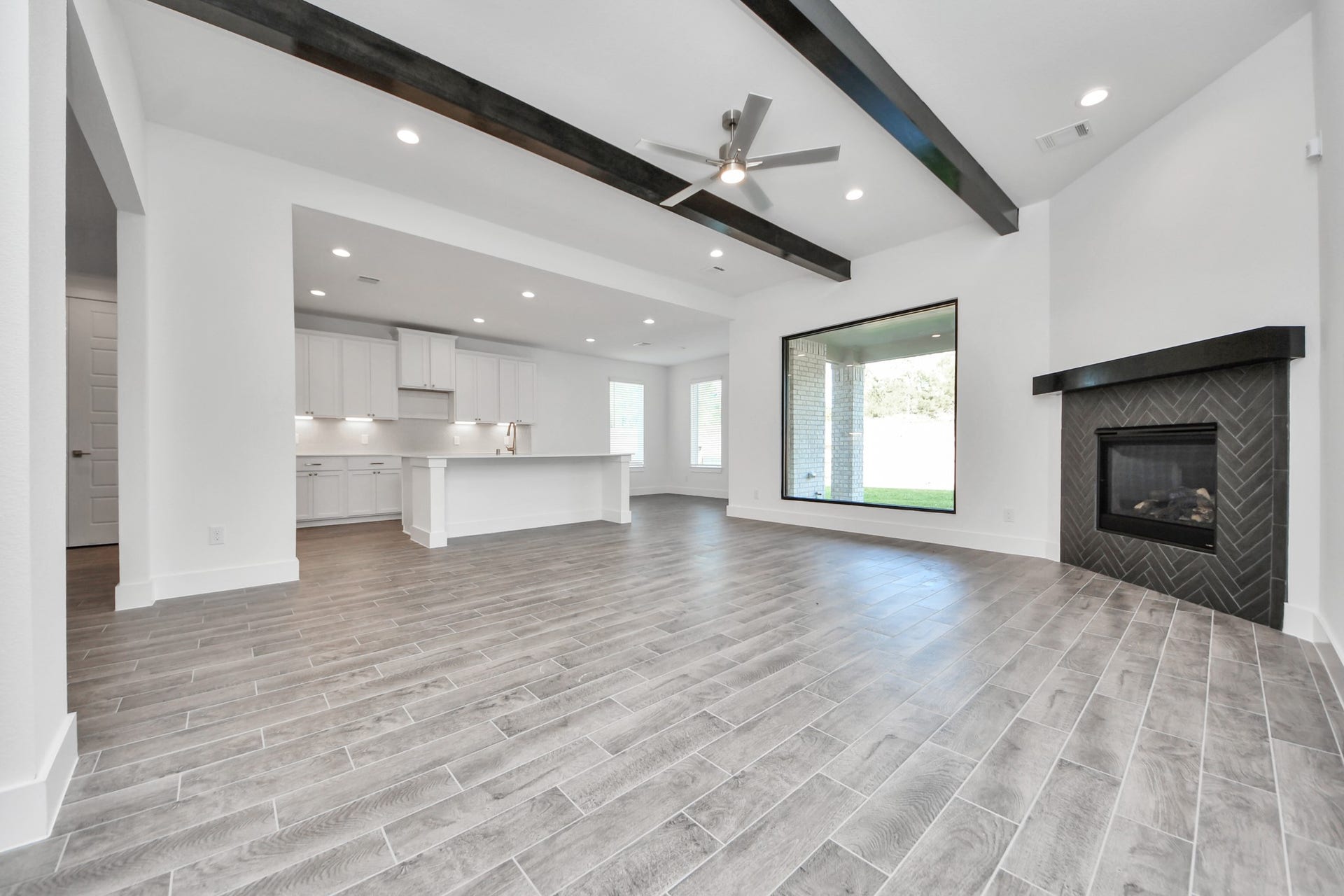2097 Corn Thistle Way, Magnolia, TX 77355 Take another glimpse into the heart of the home with this additional view of the family rooma sprawling space ready to accommodate all your gatherings.