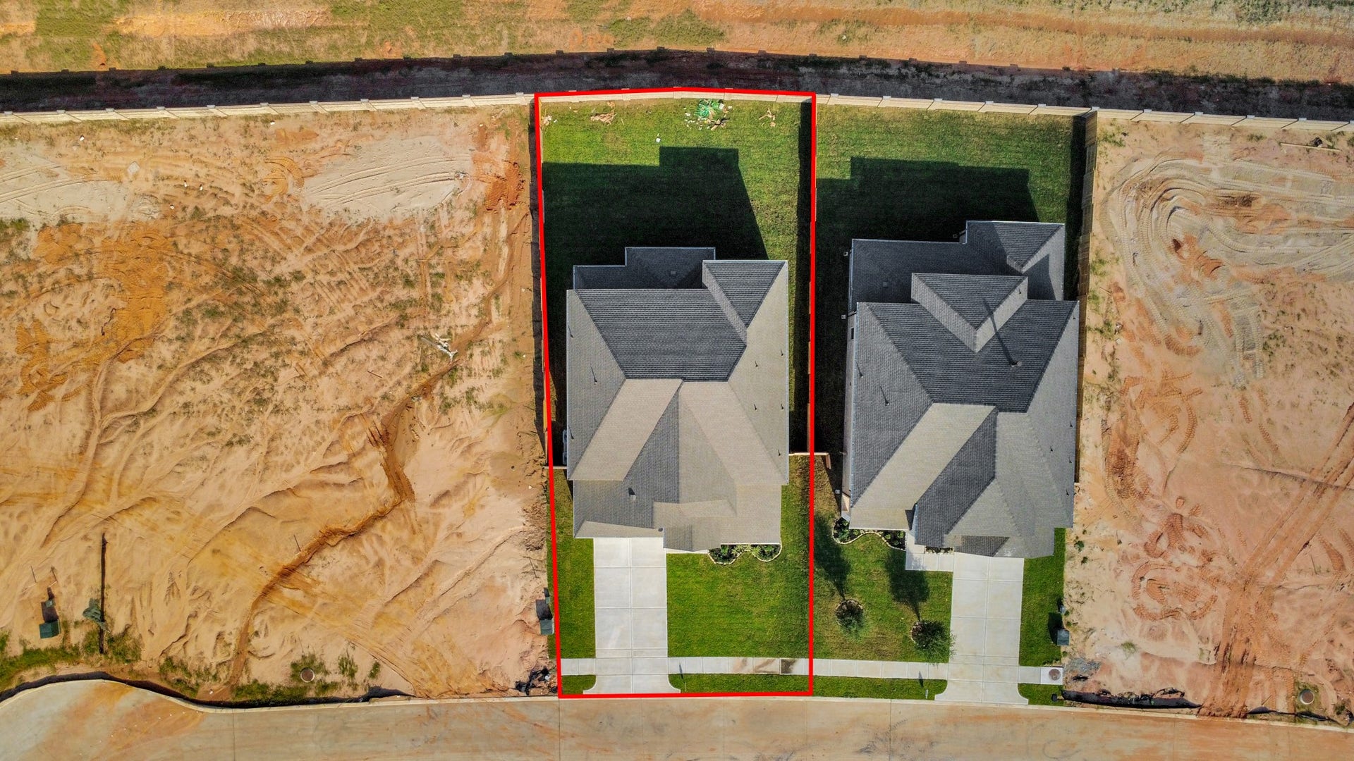 2097 Corn Thistle Way, Magnolia, TX 77355 An aerial view of a spacious subdivision lot, highlighting a well-maintained yard and a fully fenced perimeter, offering both privacy and expansive outdoor space.