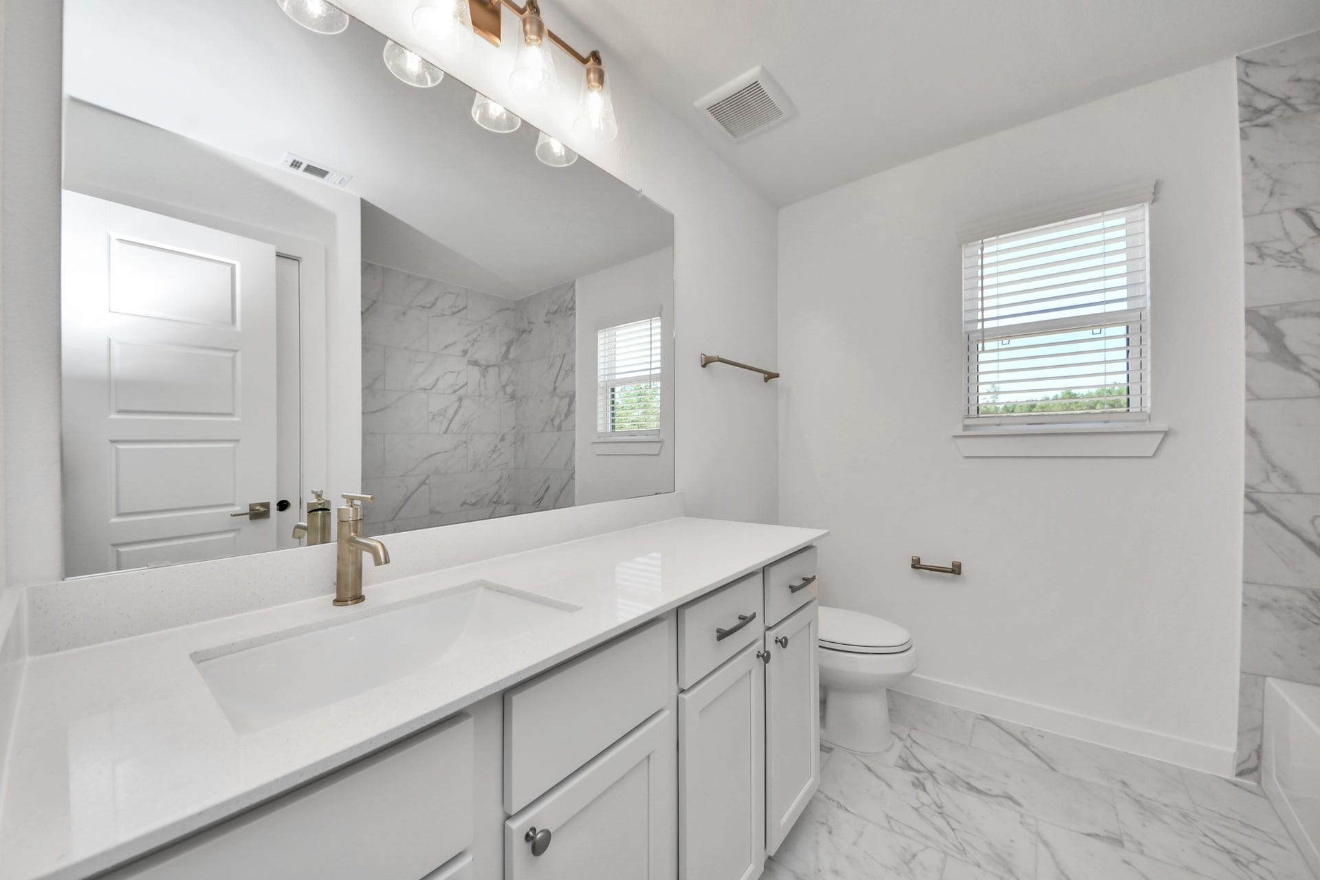 2097 Corn Thistle Way, Magnolia, TX 77355 Secondary bath features tile flooring, bath/shower combo with tile surround, light stained wood cabinets, beautiful light countertop.