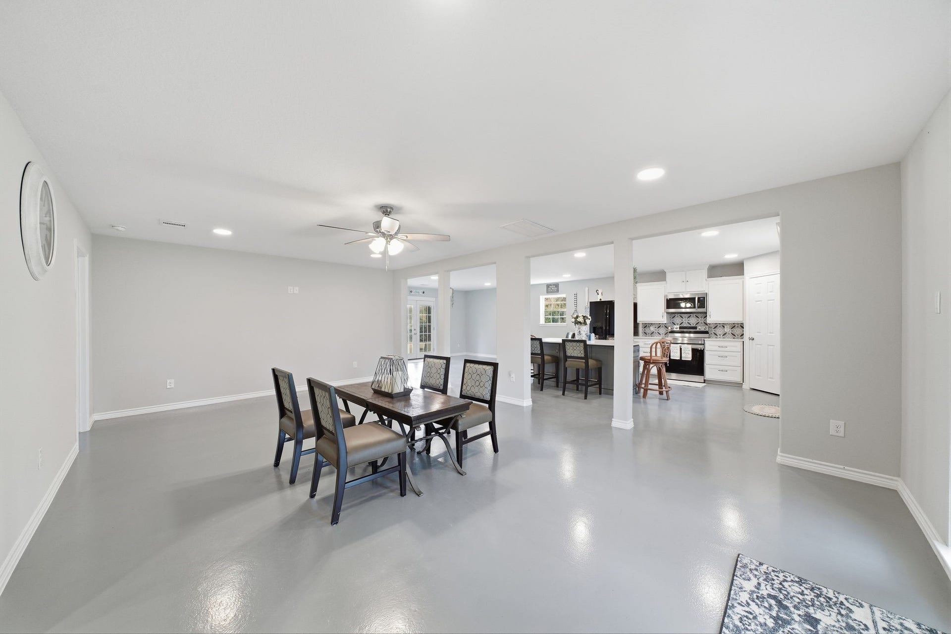 450 N Sunset Boulevard, Holiday Lakes, TX 77515 The open flow between the living room, dining room, and kitchen creates a bright, wholesome atmosphere, with distinct areas for sharing time with loved ones.