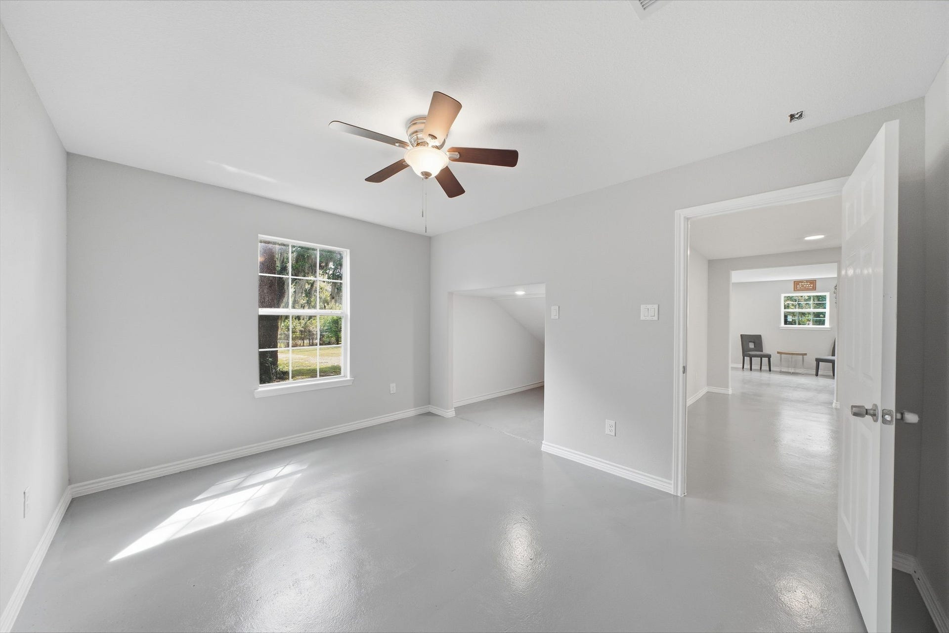 450 N Sunset Boulevard, Holiday Lakes, TX 77515 Large downstairs bedroom with a stair nook for extra storage.