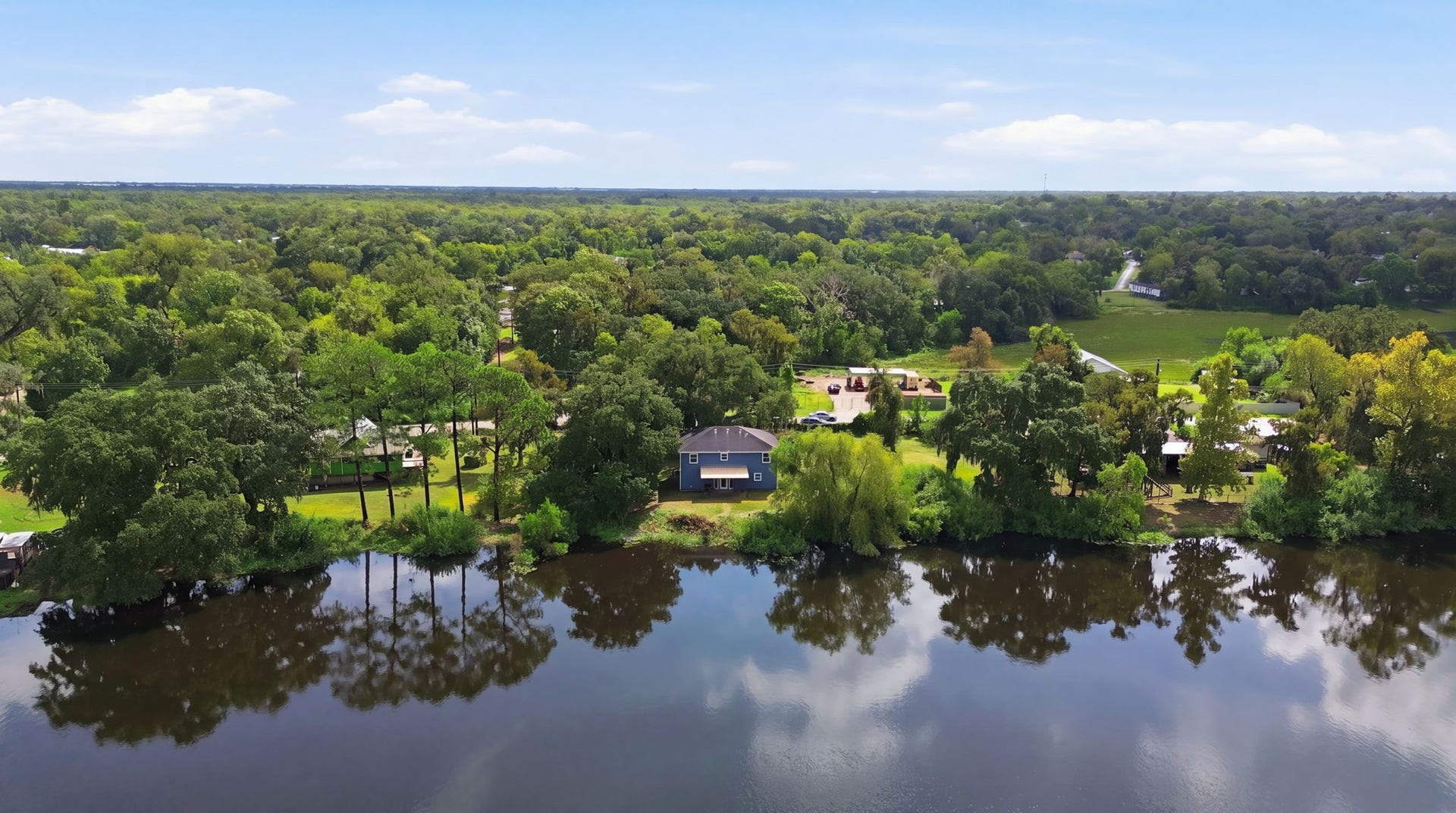 450 N Sunset Boulevard, Holiday Lakes, TX 77515 Lakeview of the waterfront backyard of theproperty.