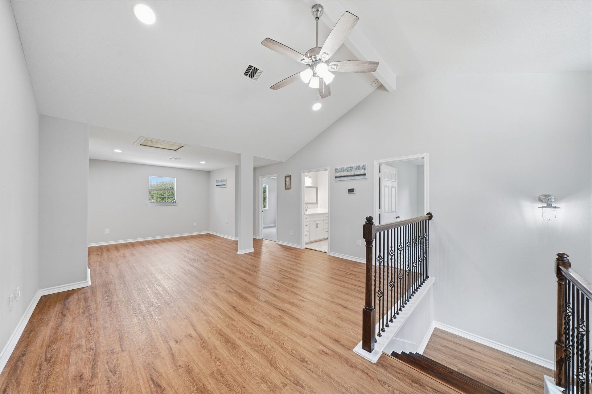 450 N Sunset Boulevard, Holiday Lakes, TX 77515 Upstairs Landing: Vaulted ceilings and bright, open space give the upper level perfect for gameroom or family privacy. Doors lead to bedrooms and a bath.