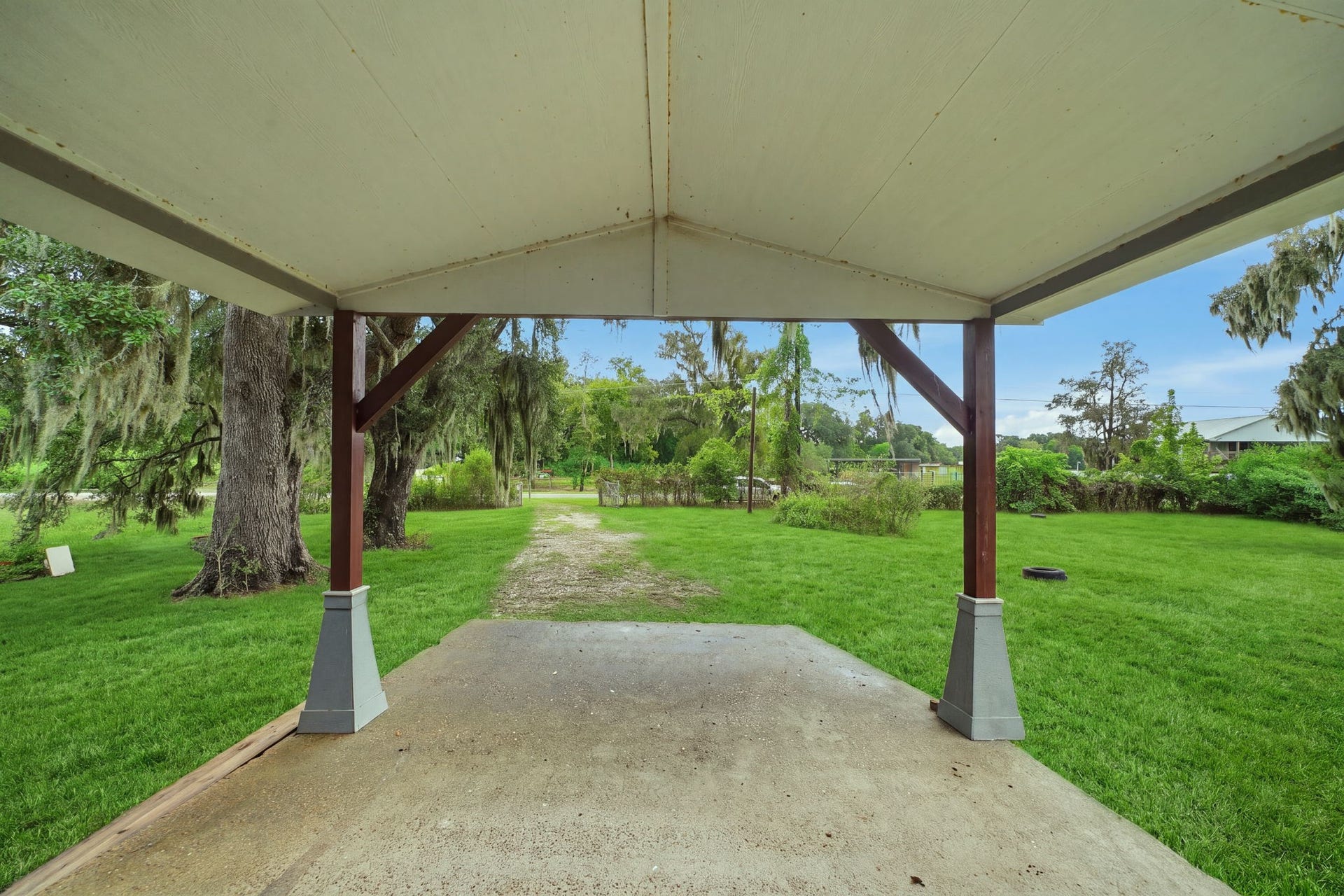 450 N Sunset Boulevard, Holiday Lakes, TX 77515 A covered carport at the front of the home comfortably fits two cars and gives you direct, sheltered access to the house.