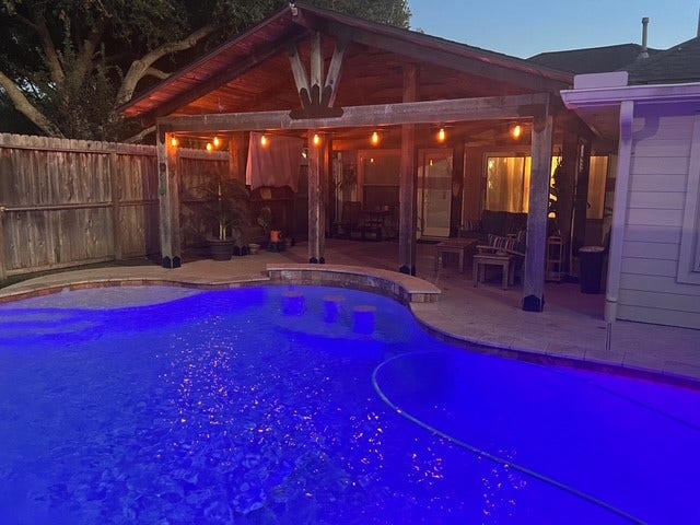 3502 Pecan Mill Drive, Sugar Land, TX 77498 The pool sparkles at nighttime.