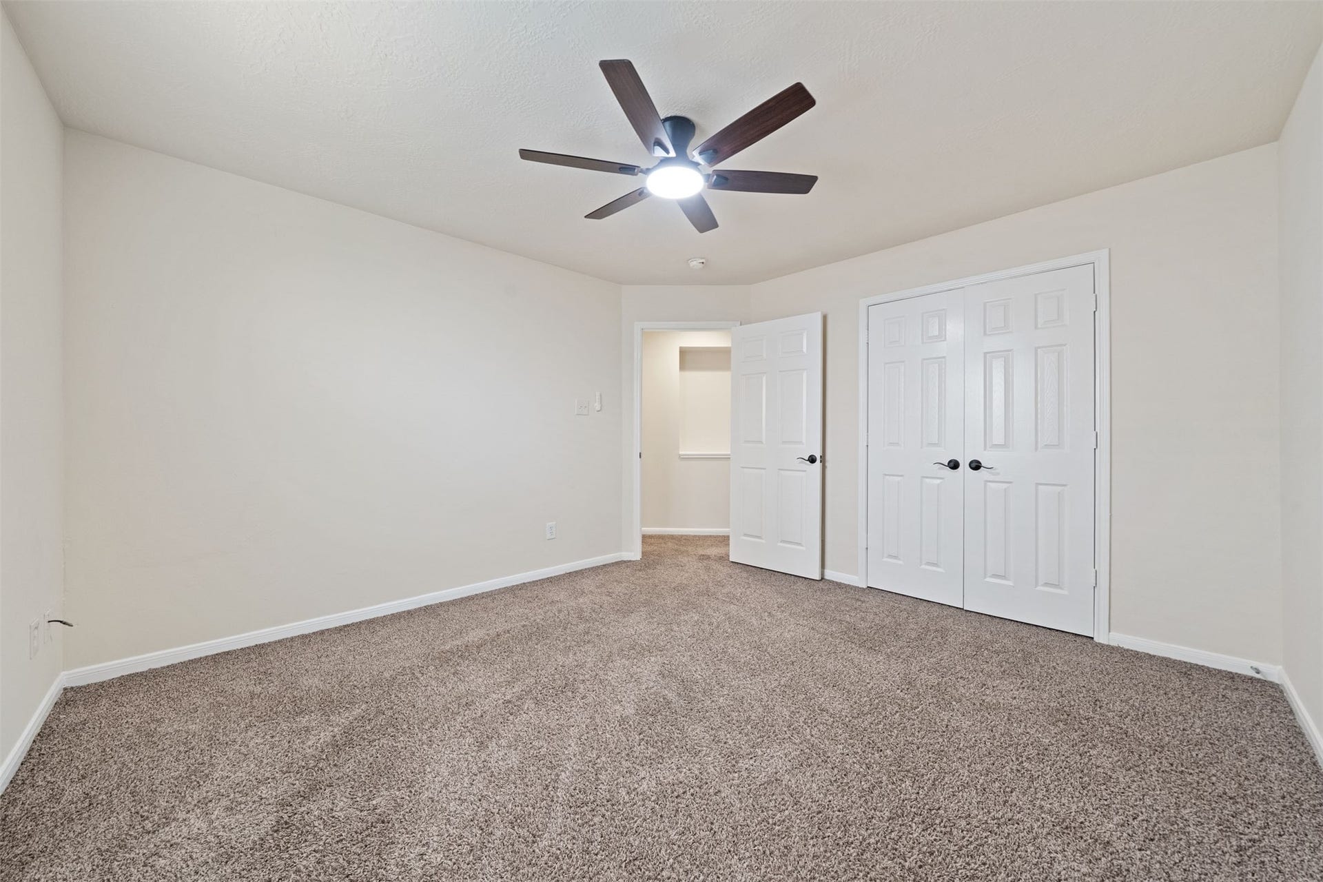 10902 Trail Ridge Drive, Houston, TX 77064 Also features plush carpet, neutral walls, and a closet space with double doors