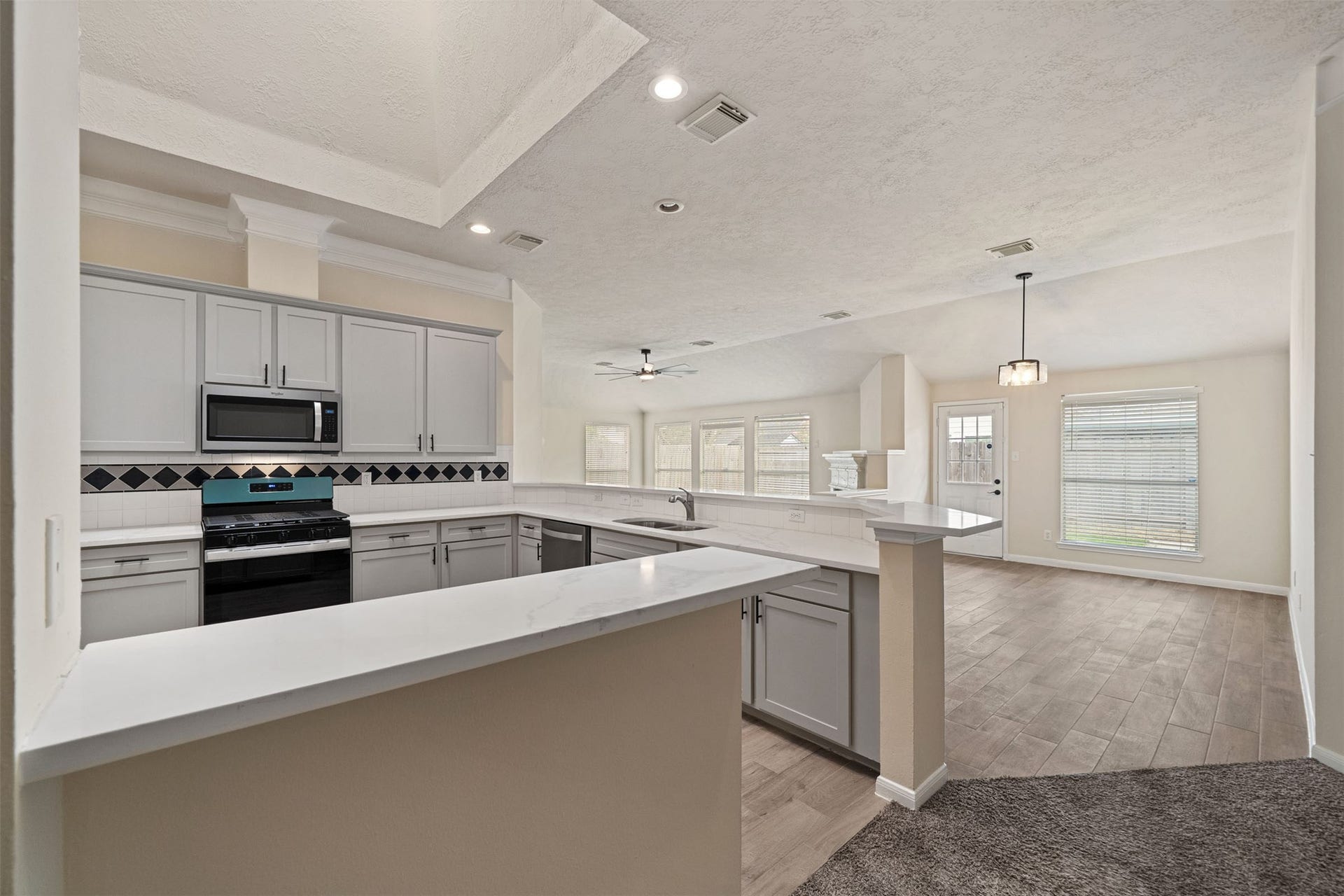10902 Trail Ridge Drive, Houston, TX 77064 Plenty of counter space for convenient meal prep while also having a breakfast bar for entertaining