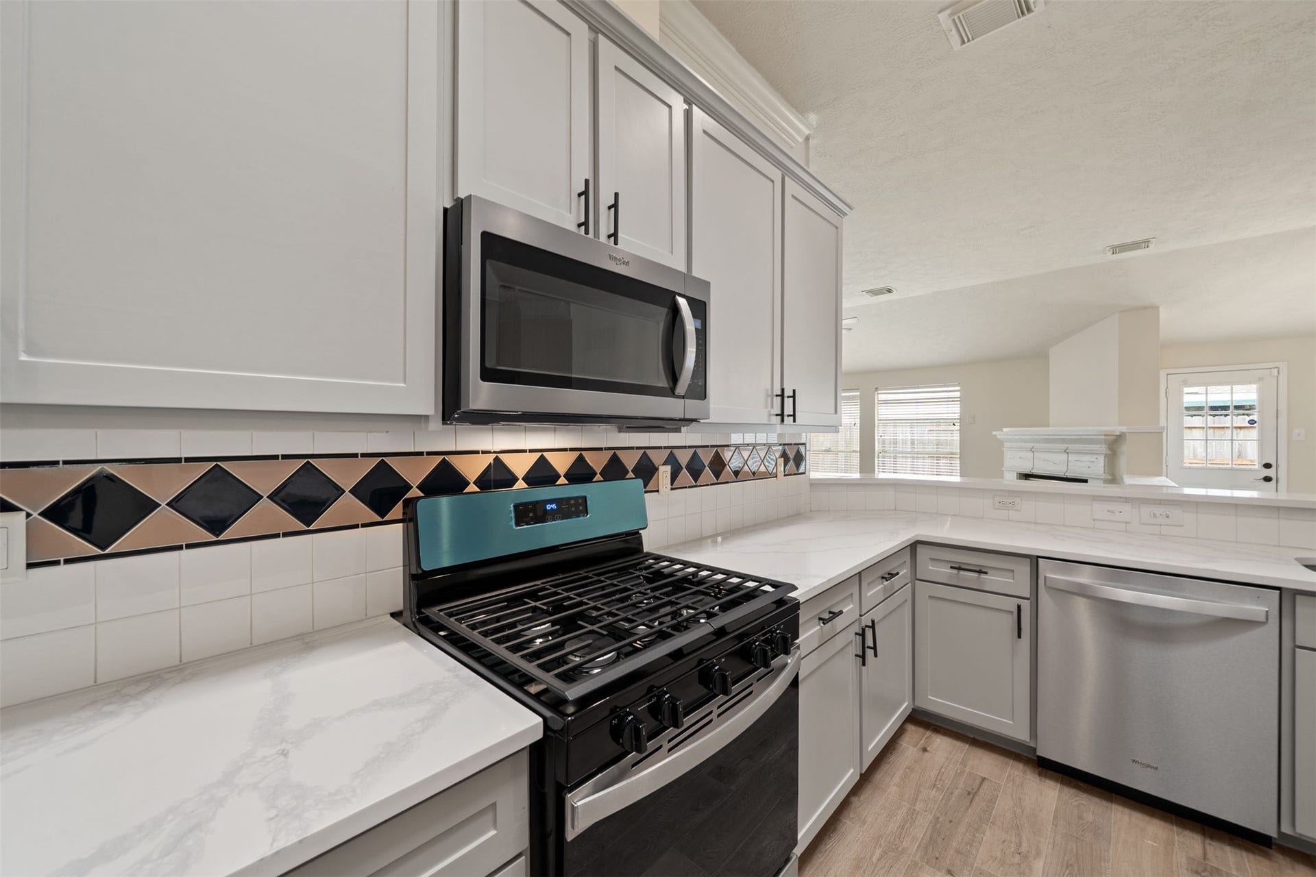 10902 Trail Ridge Drive, Houston, TX 77064 Modern design offering a bright and inviting space for cooking and entertaining.