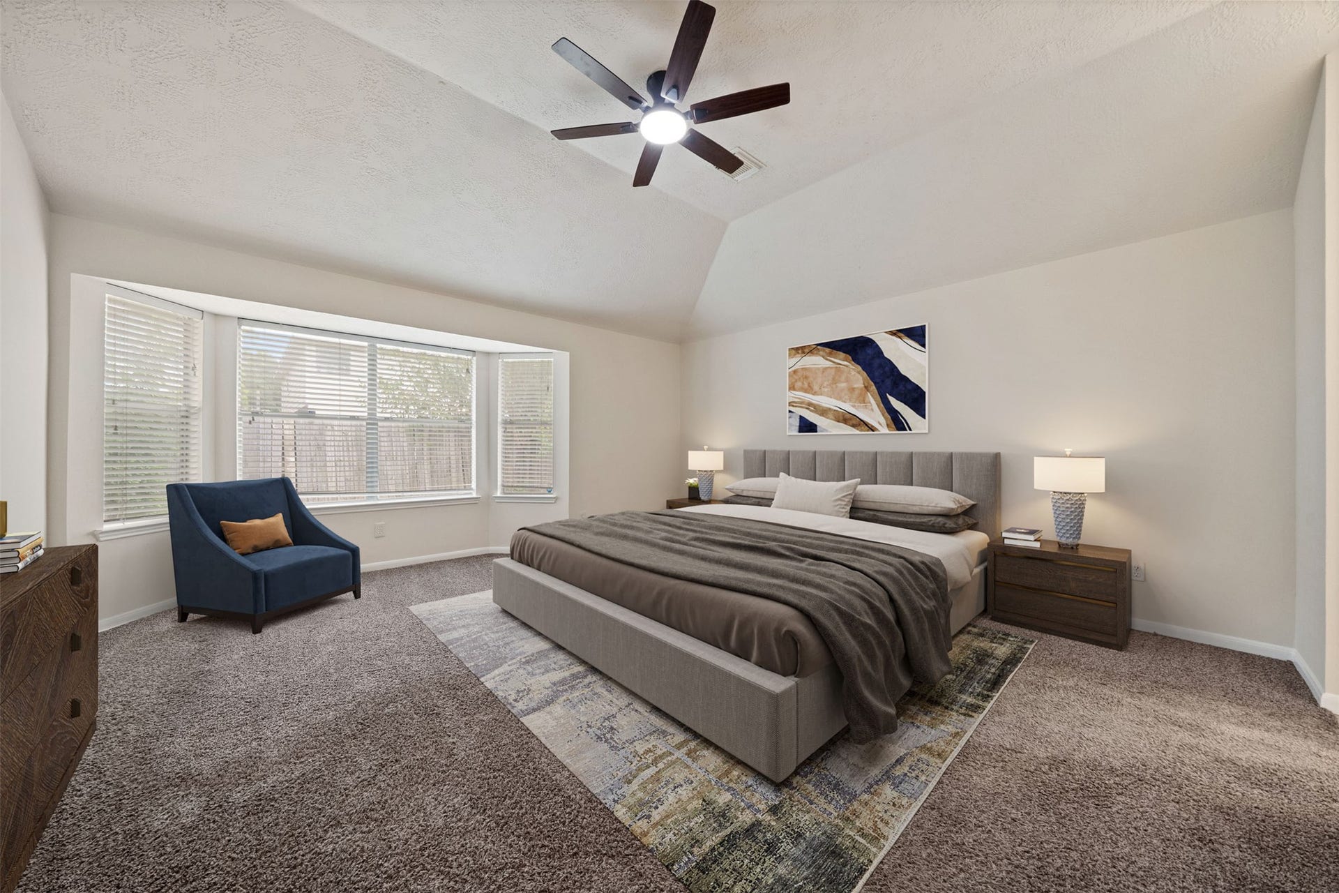 10902 Trail Ridge Drive, Houston, TX 77064 Experience the serenity of this primary bedroom suite, featuring a lovely seating area by the large bay window, perfect for relaxation and natural light. *virtually staged