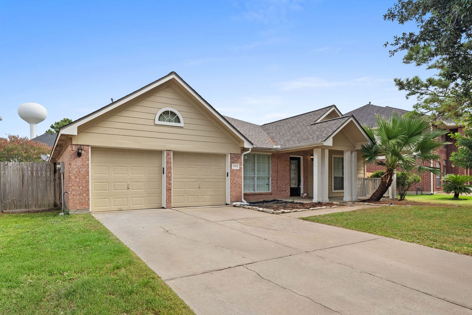 10902 Trail Ridge Drive, Houston, TX 77064 Charming single-story curb appeal with a welcoming front porch and two-car garage with new auto garage openers and epoxy flooring