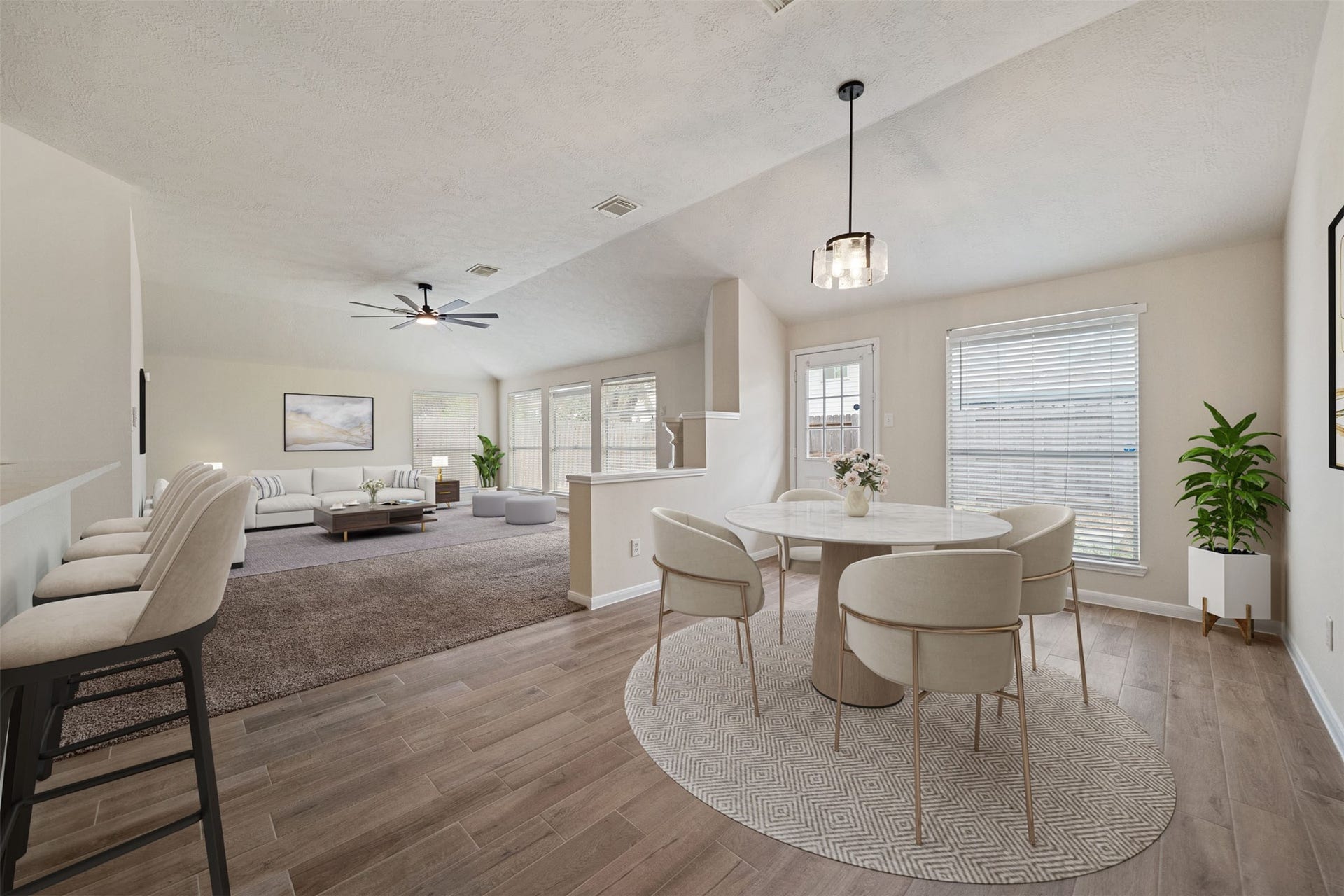 10902 Trail Ridge Drive, Houston, TX 77064 Bright breakfast area showcasing a new light fixture and ample natural light. *virtually staged