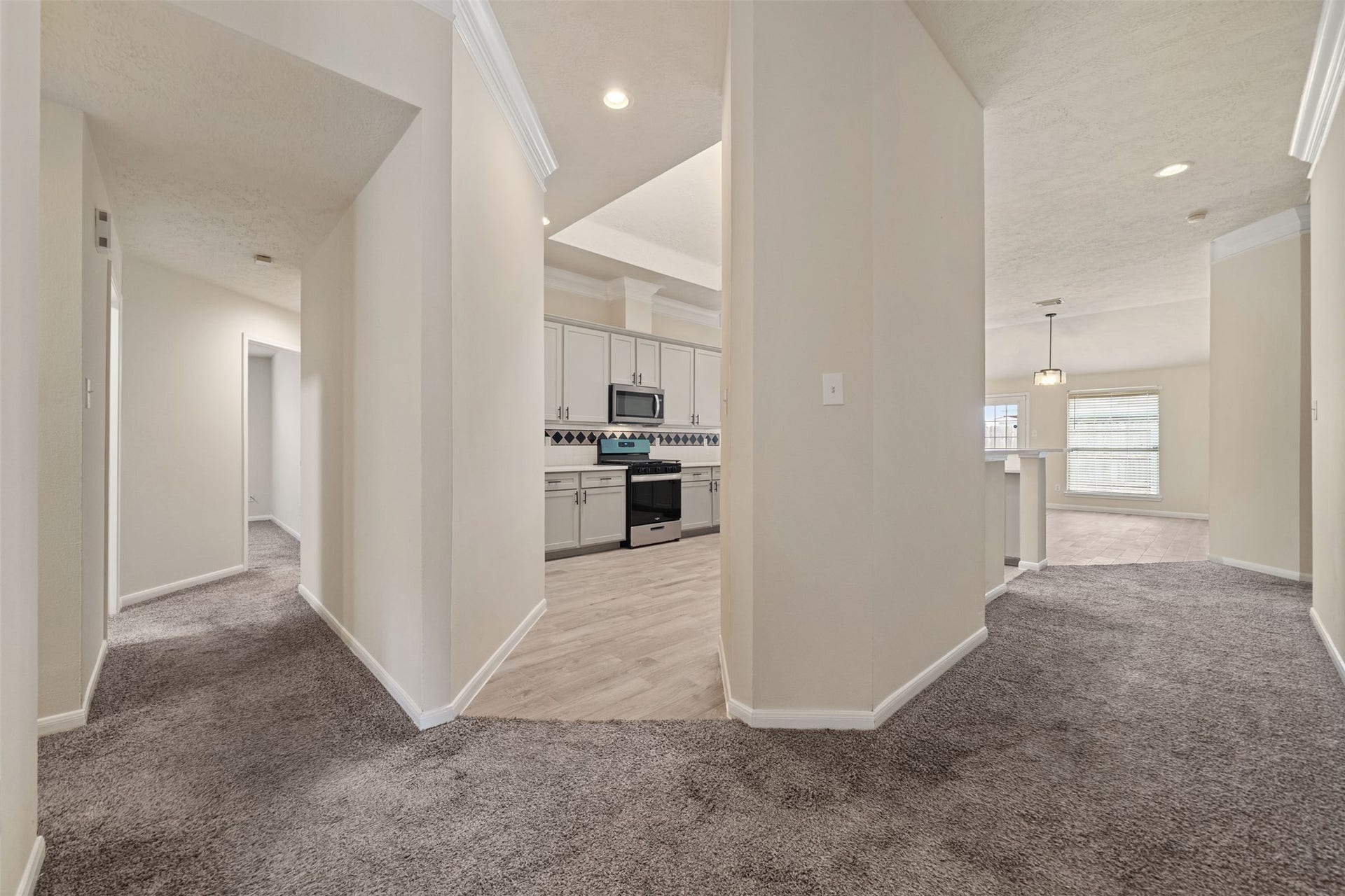 10902 Trail Ridge Drive, Houston, TX 77064 Bright and inviting hallway leads to a modern kitchen and seamlessly connecting to the bright breakfast area and den