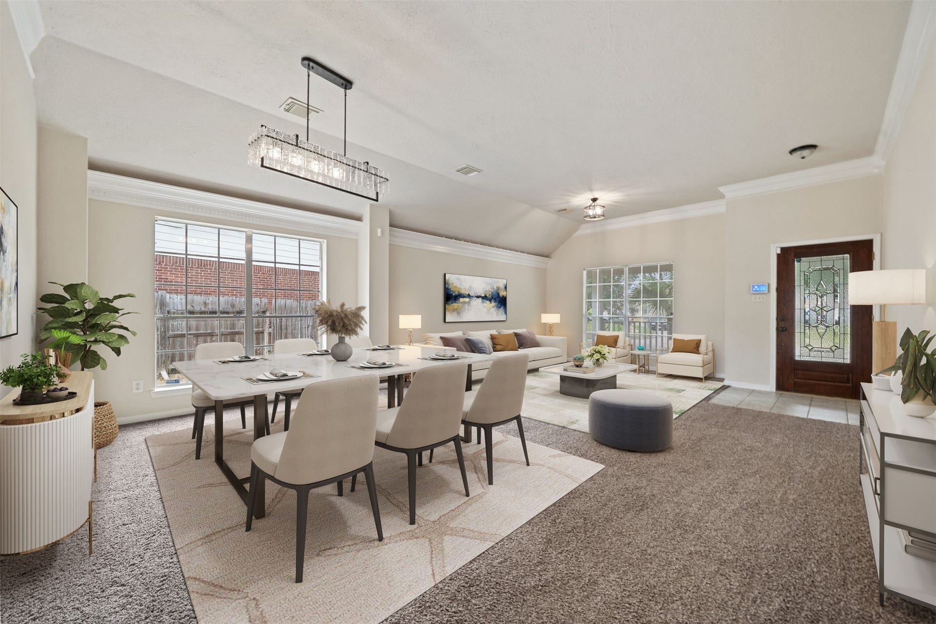 10902 Trail Ridge Drive, Houston, TX 77064 Spacious and inviting, this living and dining area features elegant light fixtures, abundant natural light, and a seamless flow perfect for entertaining. *virtually staged