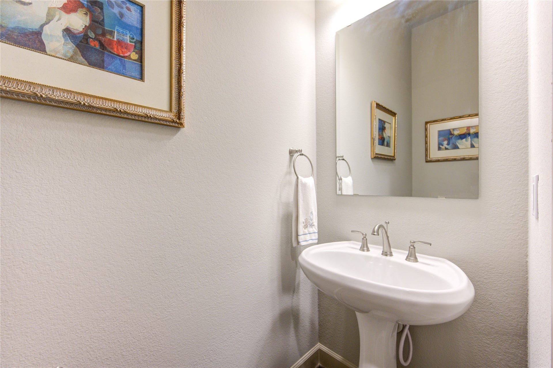 Compact yet functional, this well-appointed half bath provides convenience and charm, making it a perfect addition to the home.