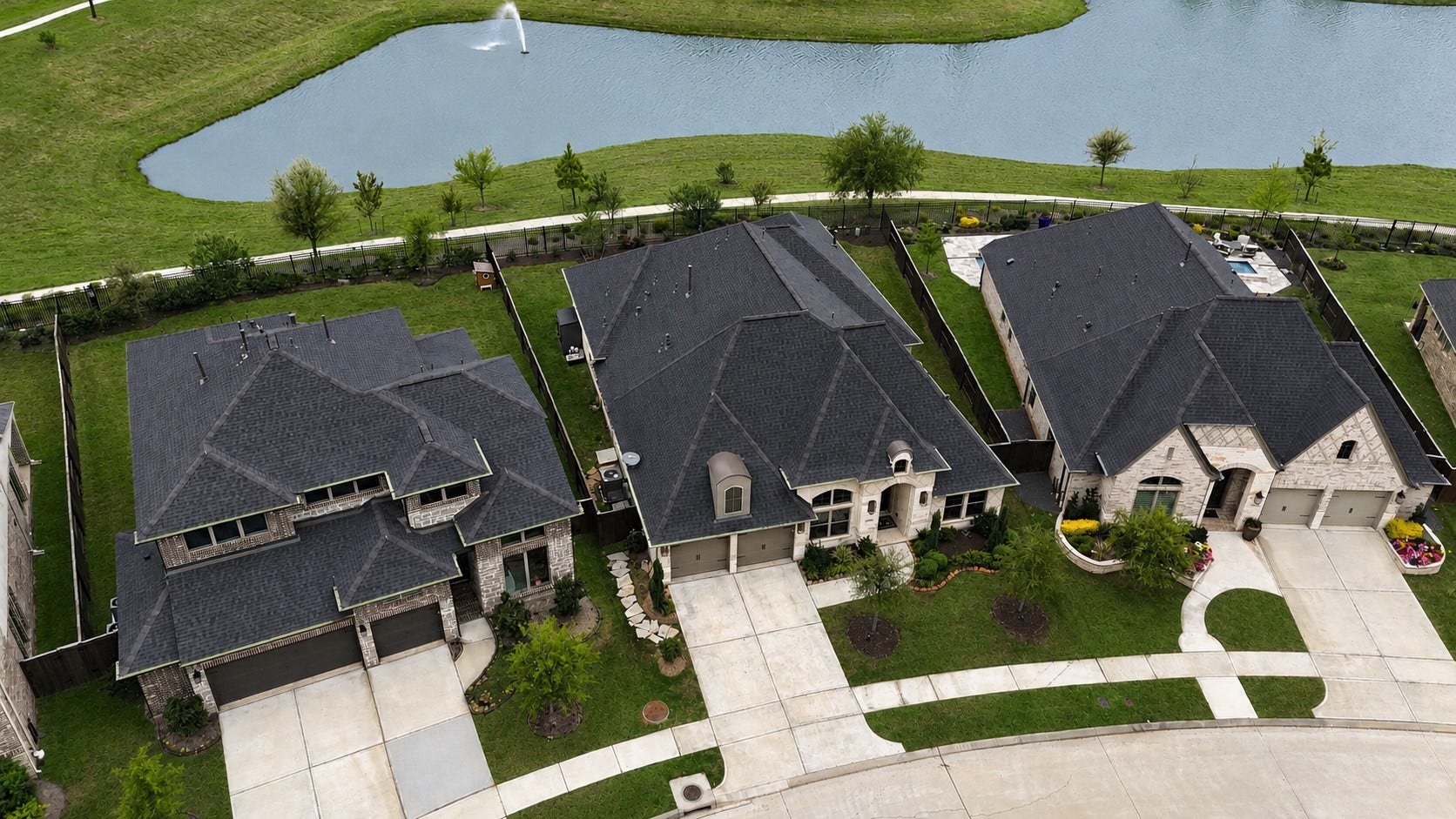 Enjoy breathtaking views of the serene lake right from your backyard. The expansive lawn provides plenty of space for outdoor activities while offering a peaceful setting with water views.