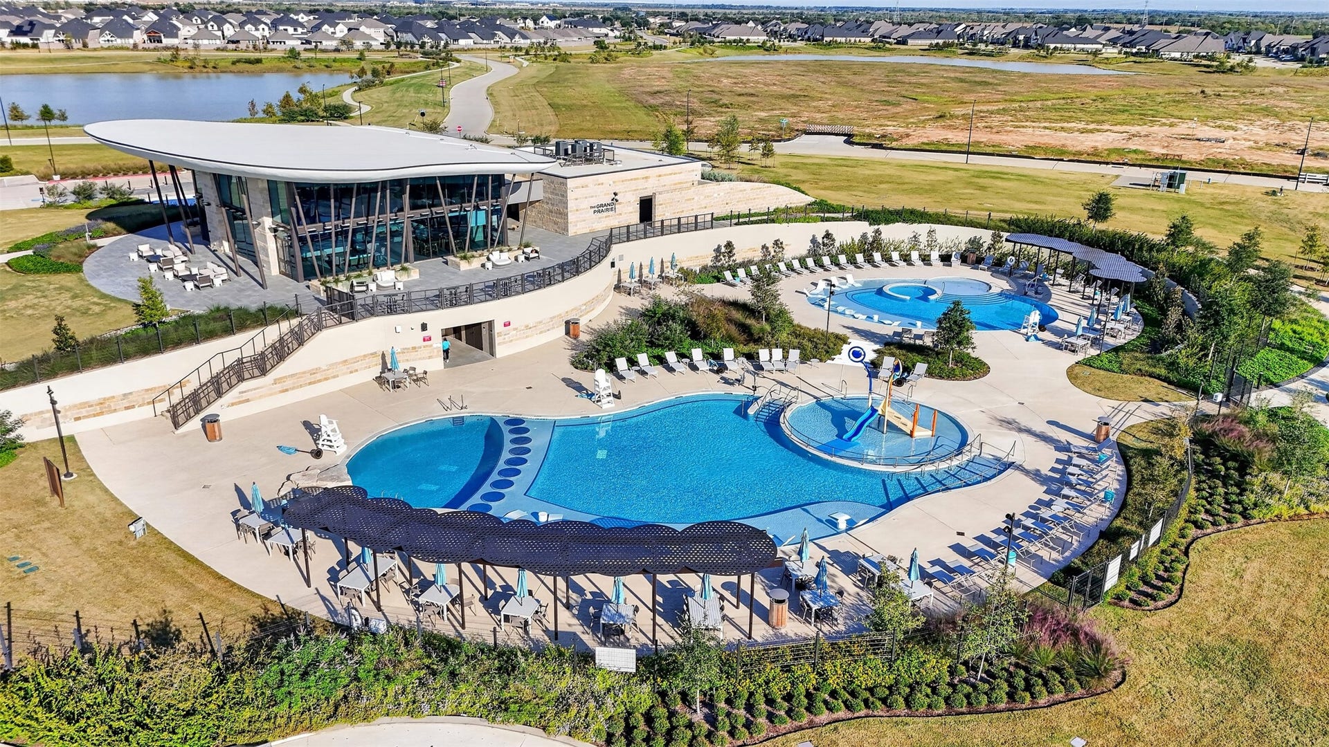 16270 Blue Mistflower Lane, Hockley, TX 77447 Resort-Style Community Amenities: Experience resort-inspired living with expansive swimming pools, splash features, poolside lounging areas, and a stunning clubhouse overlooking the community's scenic landscape.