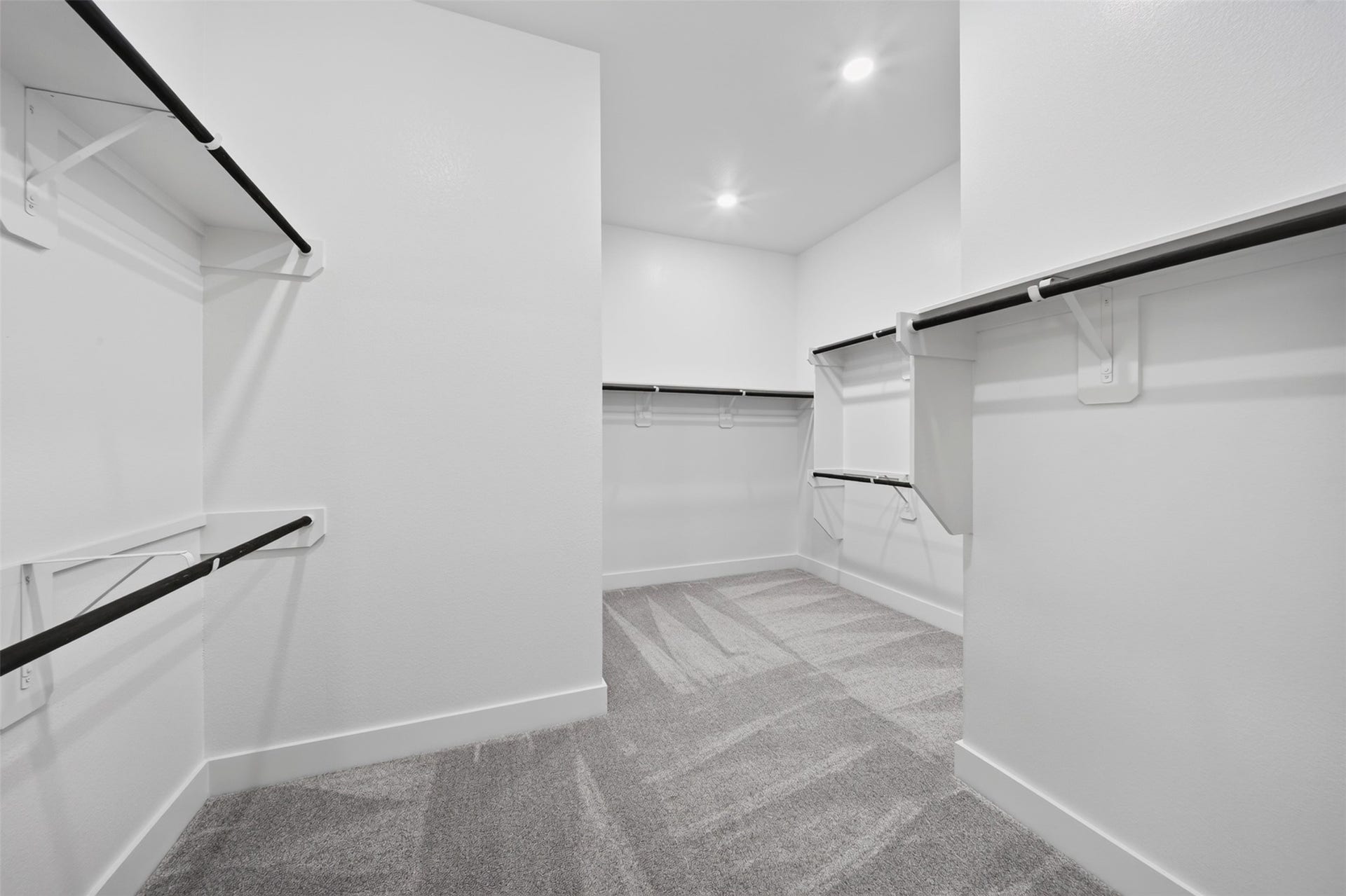 16270 Blue Mistflower Lane, Hockley, TX 77447 Primary Walk-In Closet: Generously sized primary closet featuring multiple hanging areas, shelving, and an expansive layout for everyday organization.