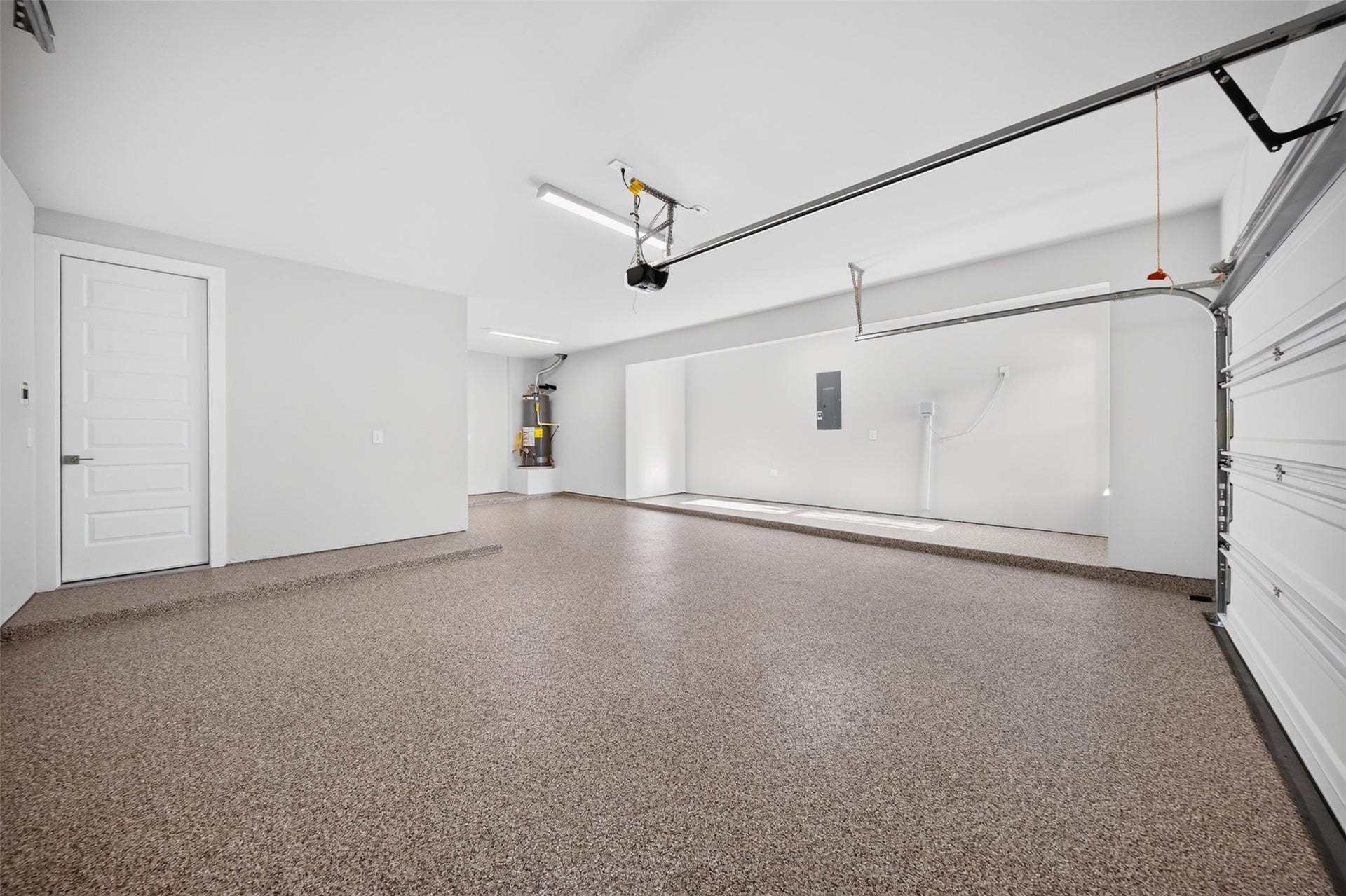 16270 Blue Mistflower Lane, Hockley, TX 77447 Three-Car Garage Additional View: Another perspective showcases the generous garage layout, finished flooring, and versatile space for vehicles, equipment, and additional storage.