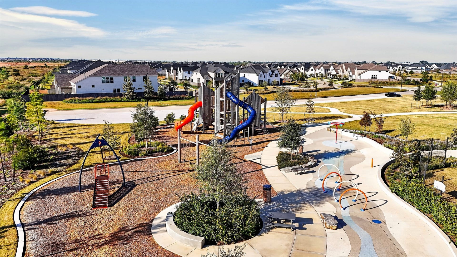 16270 Blue Mistflower Lane, Hockley, TX 77447 Community Playground & Splash Pad: Enjoy beautifully designed outdoor recreation areas featuring colorful playground equipment, winding slides, an interactive splash pad, and inviting gathering spaces.