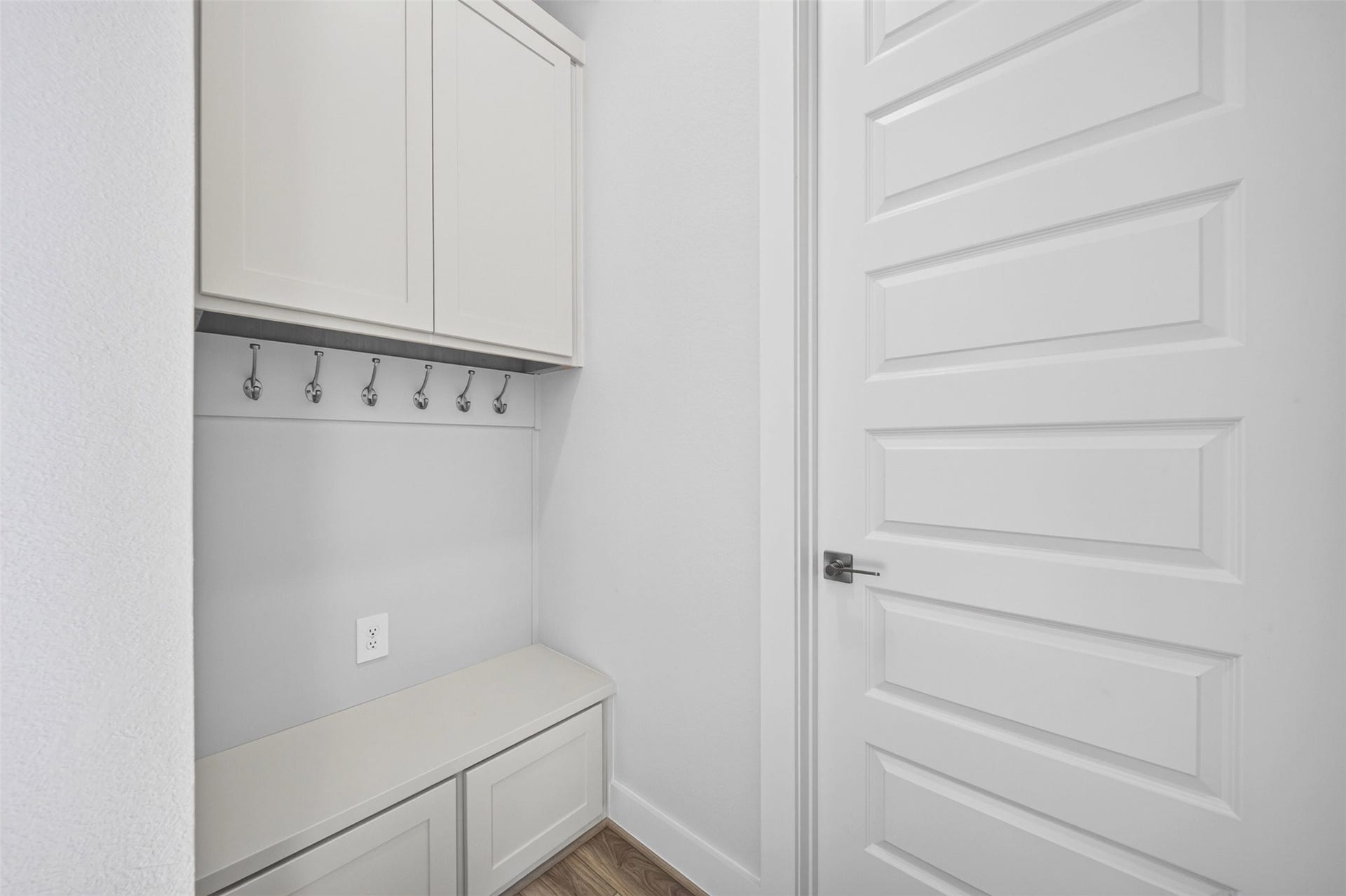 16270 Blue Mistflower Lane, Hockley, TX 77447 11. Built-In Storage & Drop Zone: Thoughtfully designed storage area featuring built-in cabinetry, a convenient bench, and wall hooks, providing an organized space for everyday essentials.