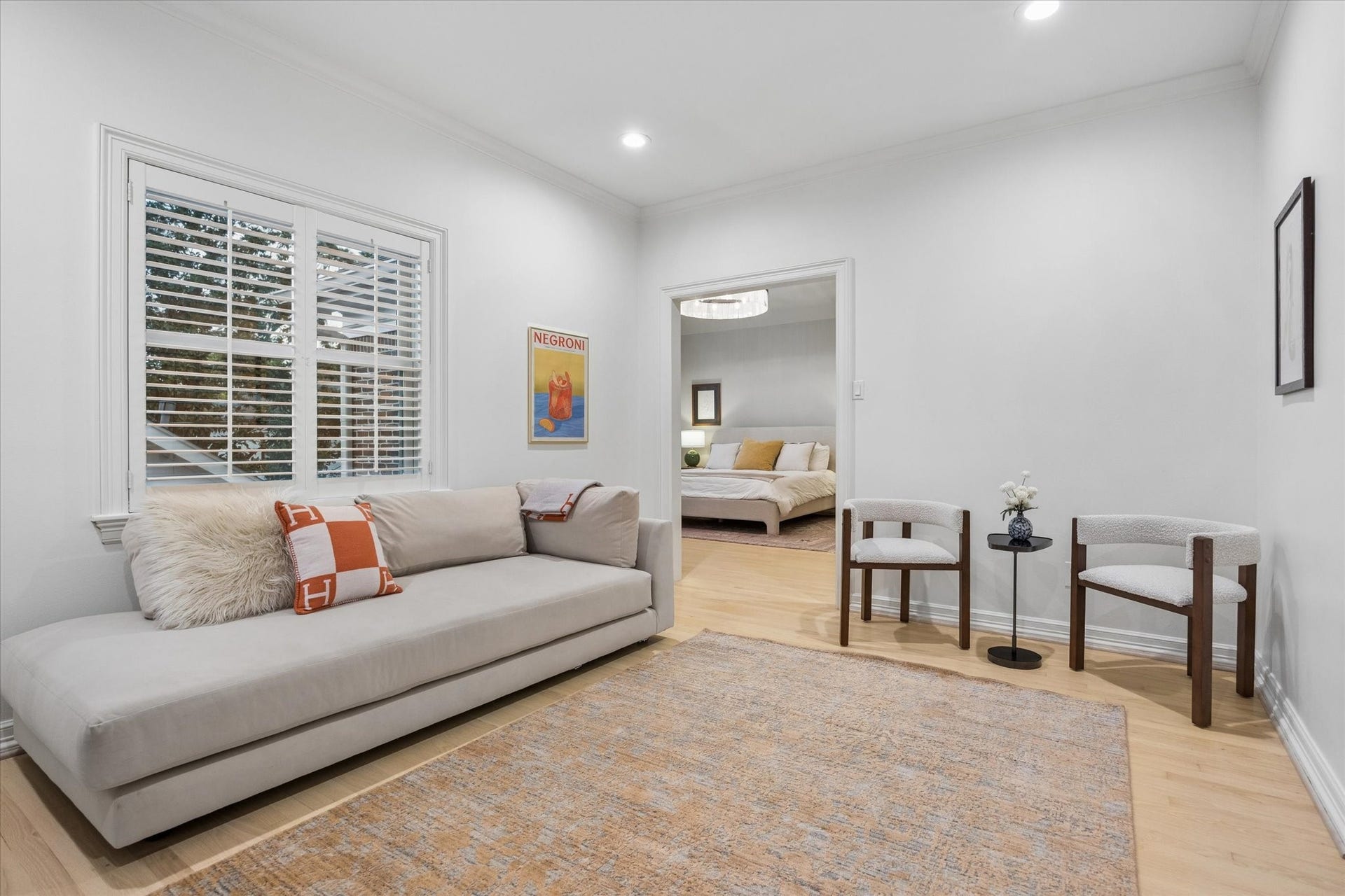 Another view of the adjoining bedroom, highlighting its spacious layout and direct connection to the primary suite.