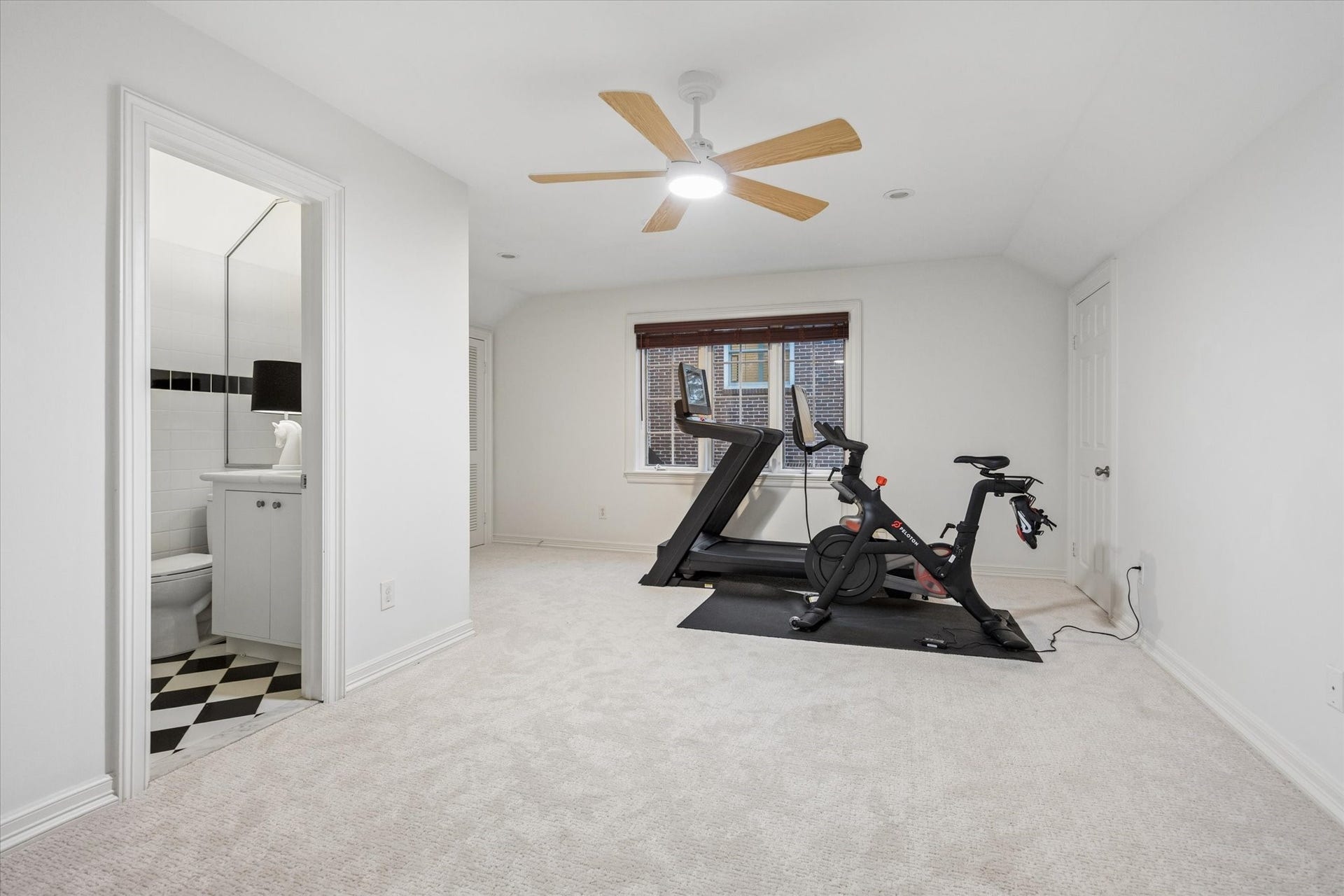 Versatile garage apartment with a full bathroom, air conditioning, and an exceptionally large storage area.