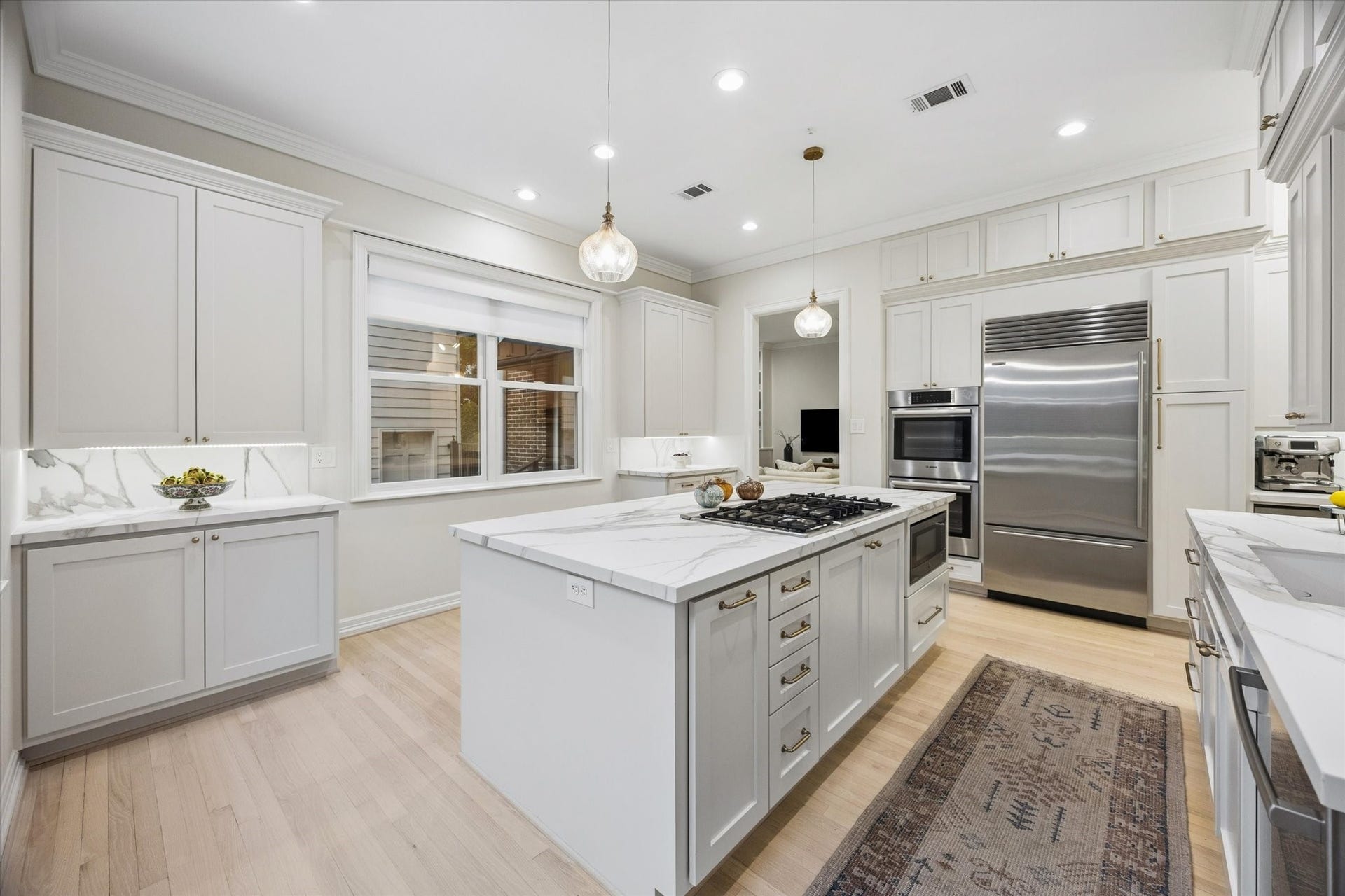 The spacious kitchen flows directly into the family room, creating an open, connected layout ideal for everyday living, gatherings and entertaining.