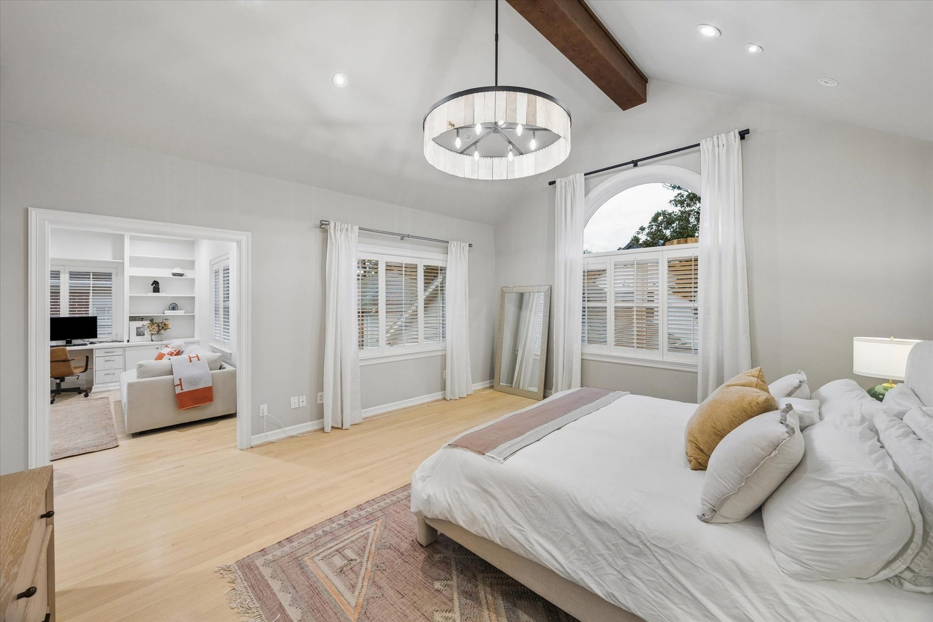 The adjoining bedroom offers exceptional flexibility and can function beautifully as a private home office, nursery, sitting room or additional bedroom, with convenient direct access from the primary suite.