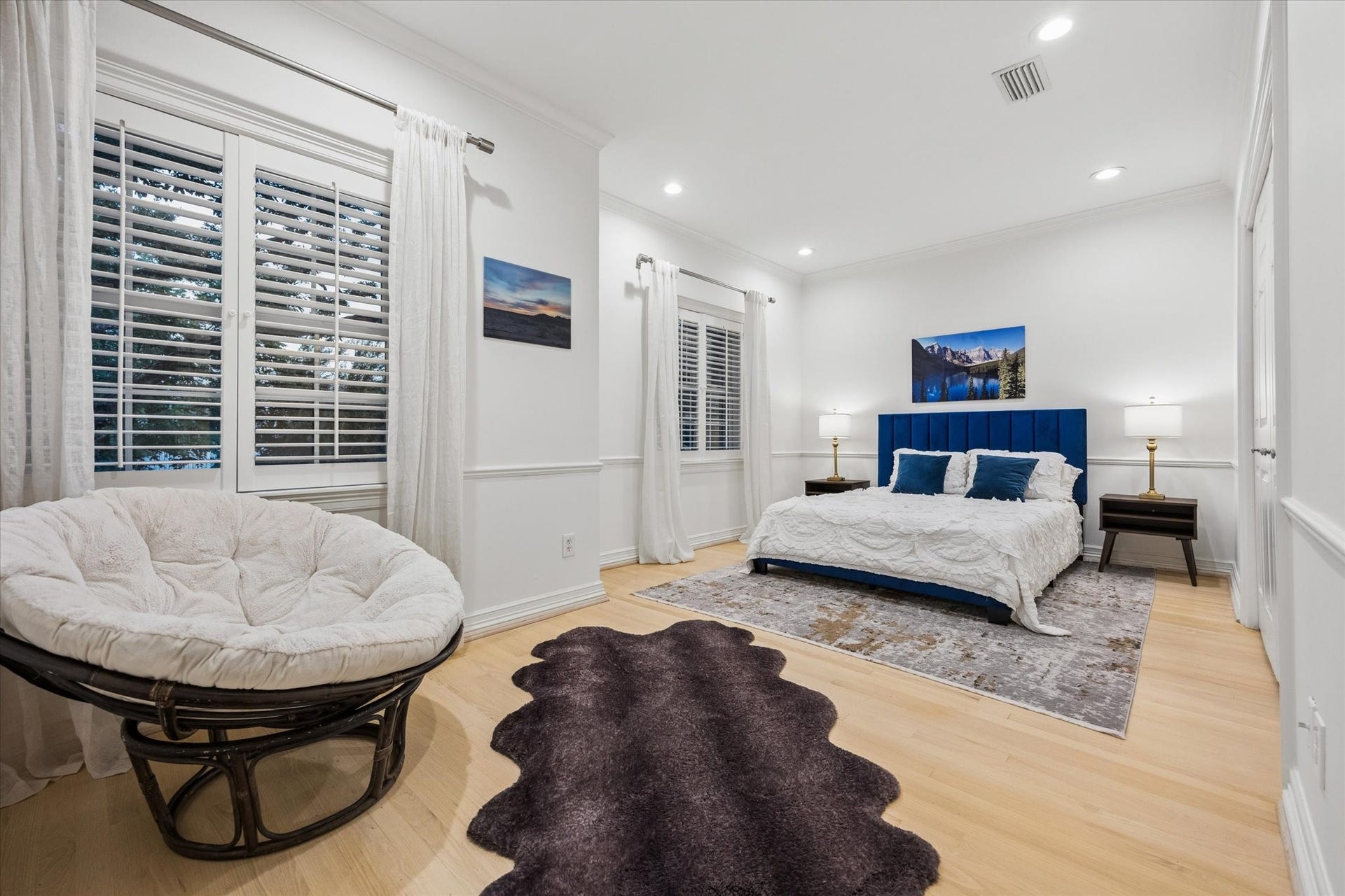 Spacious secondary bedroom with generous proportions, abundant natural light and beautiful hardwood floors.