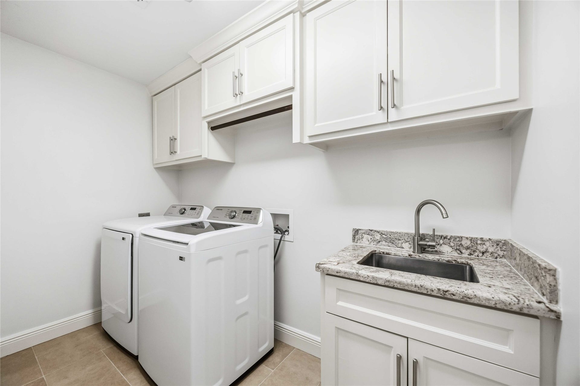 5722 N Braeswood Boulevard, Houston, TX 77096 Utility room w/ full sink and cabinets. W & D included!