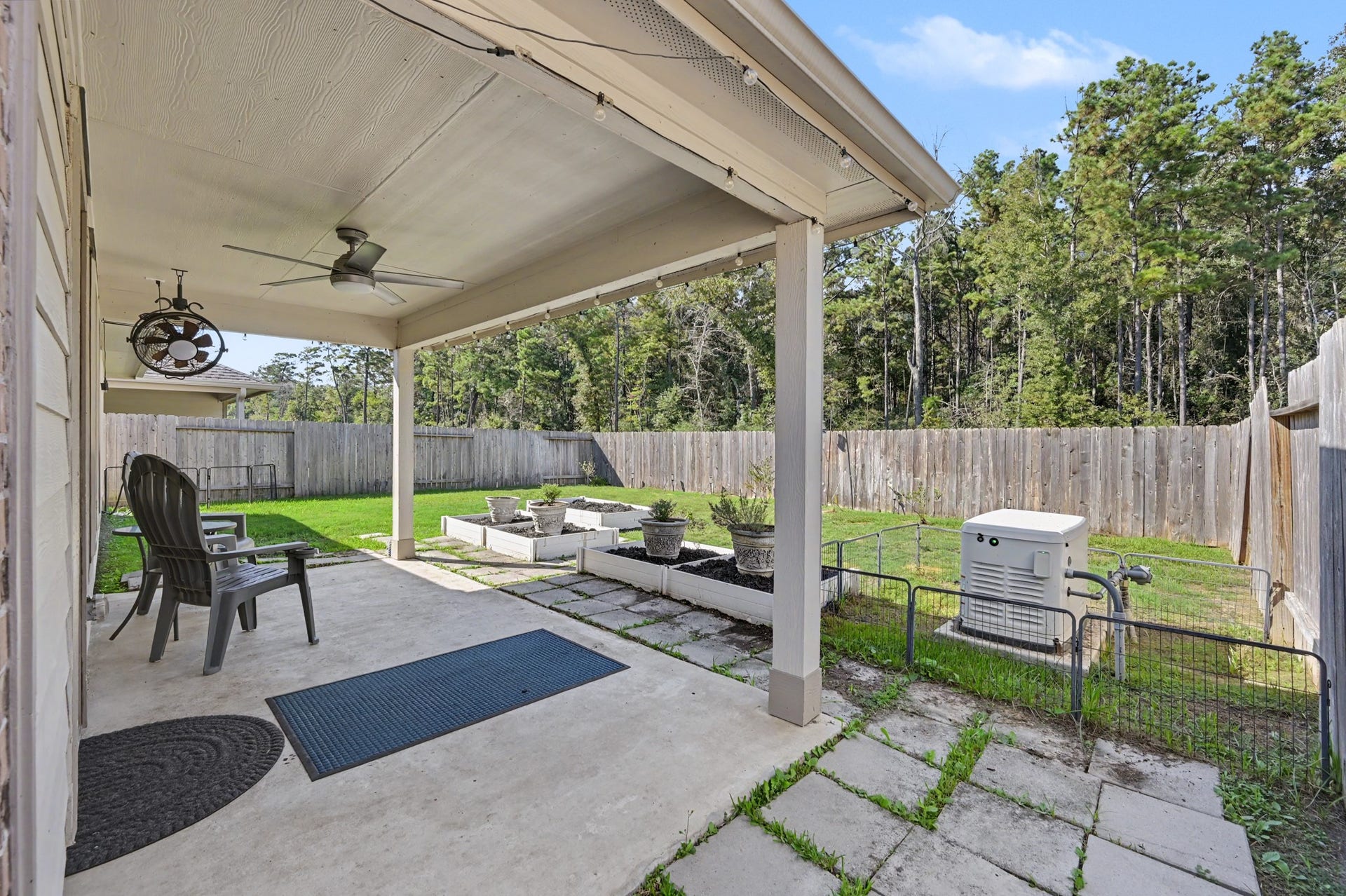 Spacious Covered patio with no back neighbors and a full house home generator and raised vegetable beds