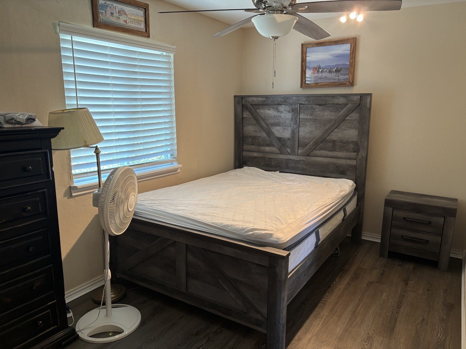 5324 Aurora Drive S, #CR378, Alvin, TX 77511 Cozy bedroom with a sleek nightstand and wood like flooring.