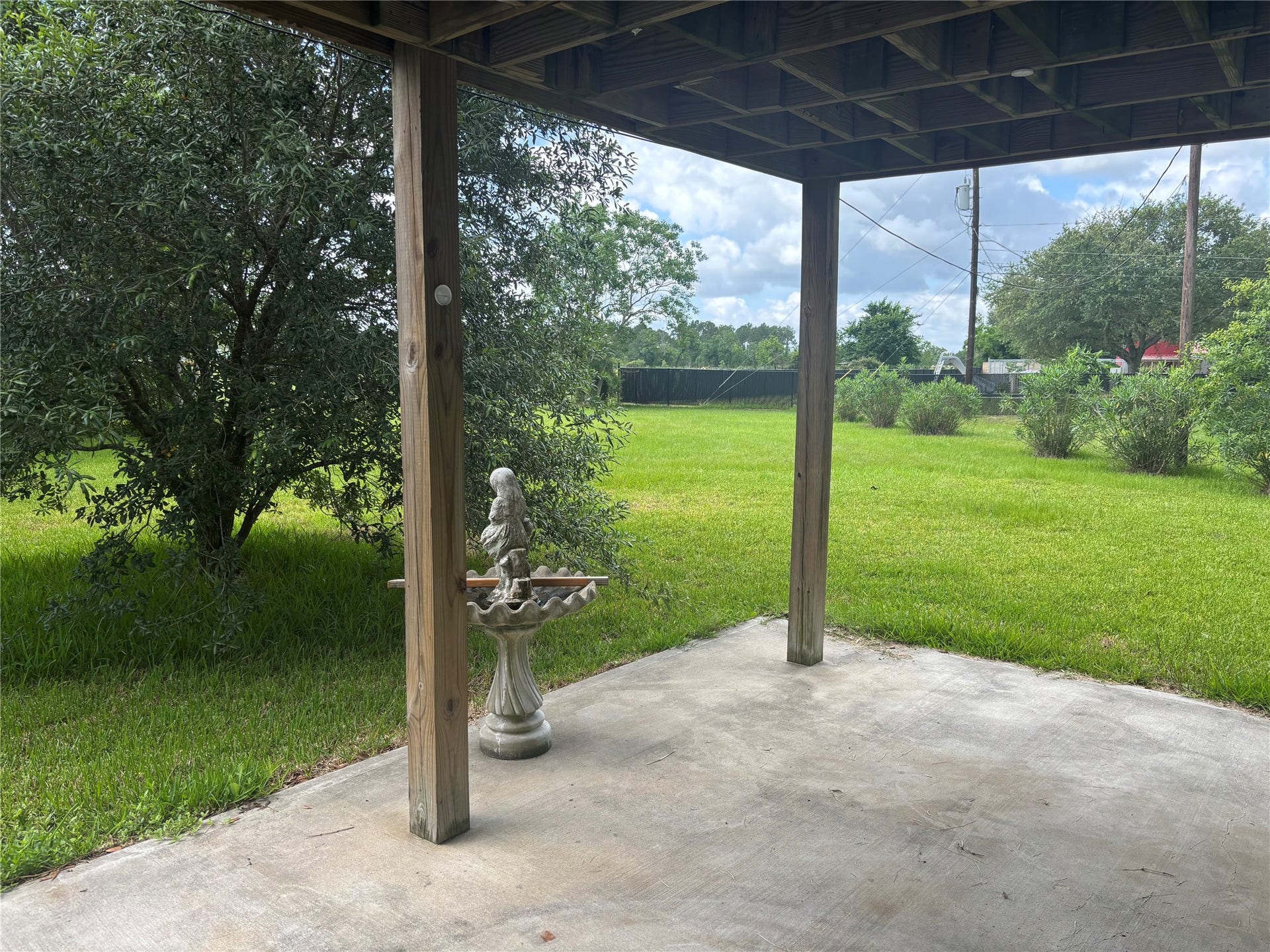 5324 Aurora Drive S, #CR378, Alvin, TX 77511 Serene lower-level patio with picturesque country views.