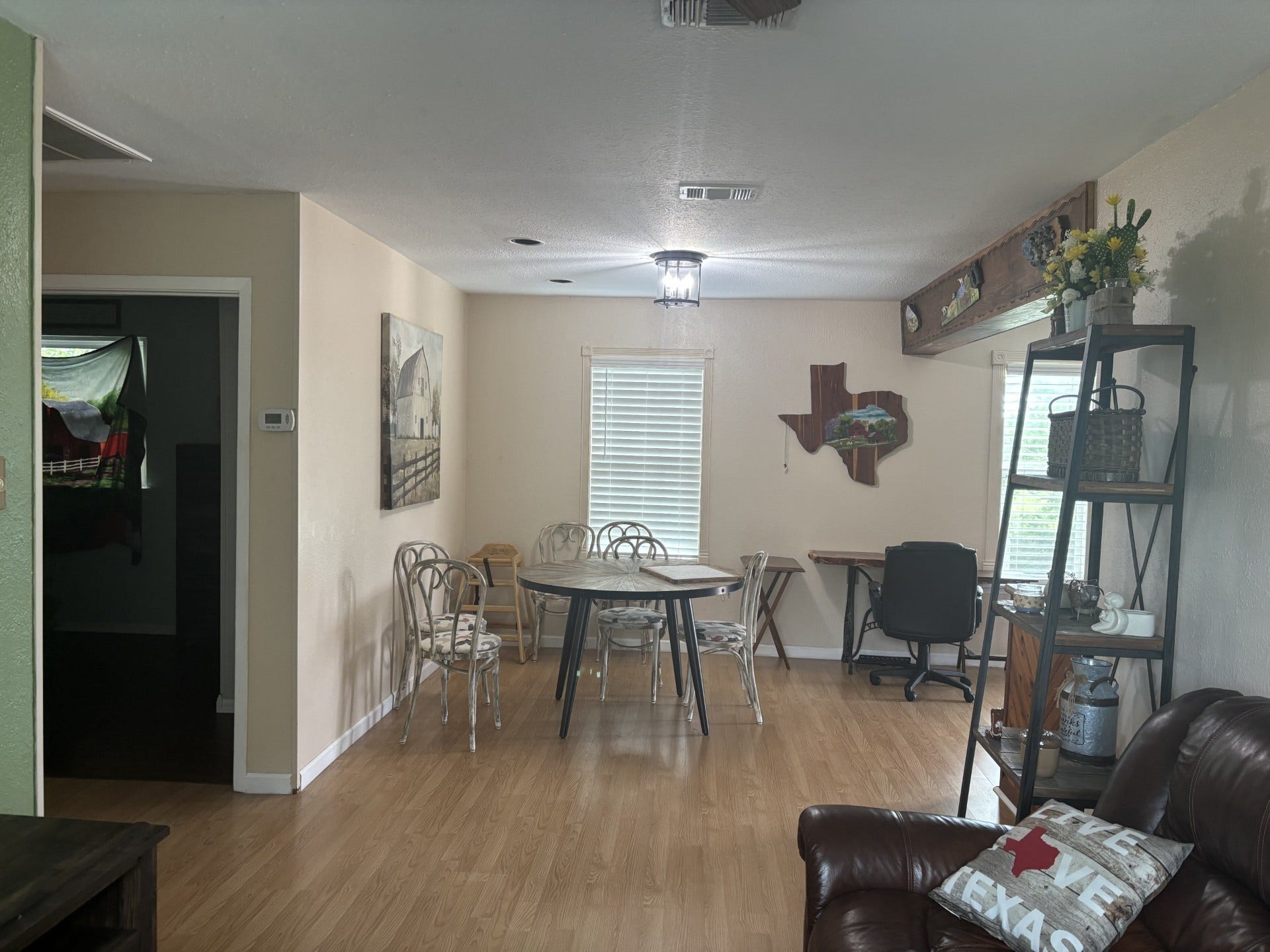 5324 Aurora Drive S, #CR378, Alvin, TX 77511 Experience open-concept living with a seamless dining and living area, enhanced by large windows that flood the space with natural light and highlight scenic country views.