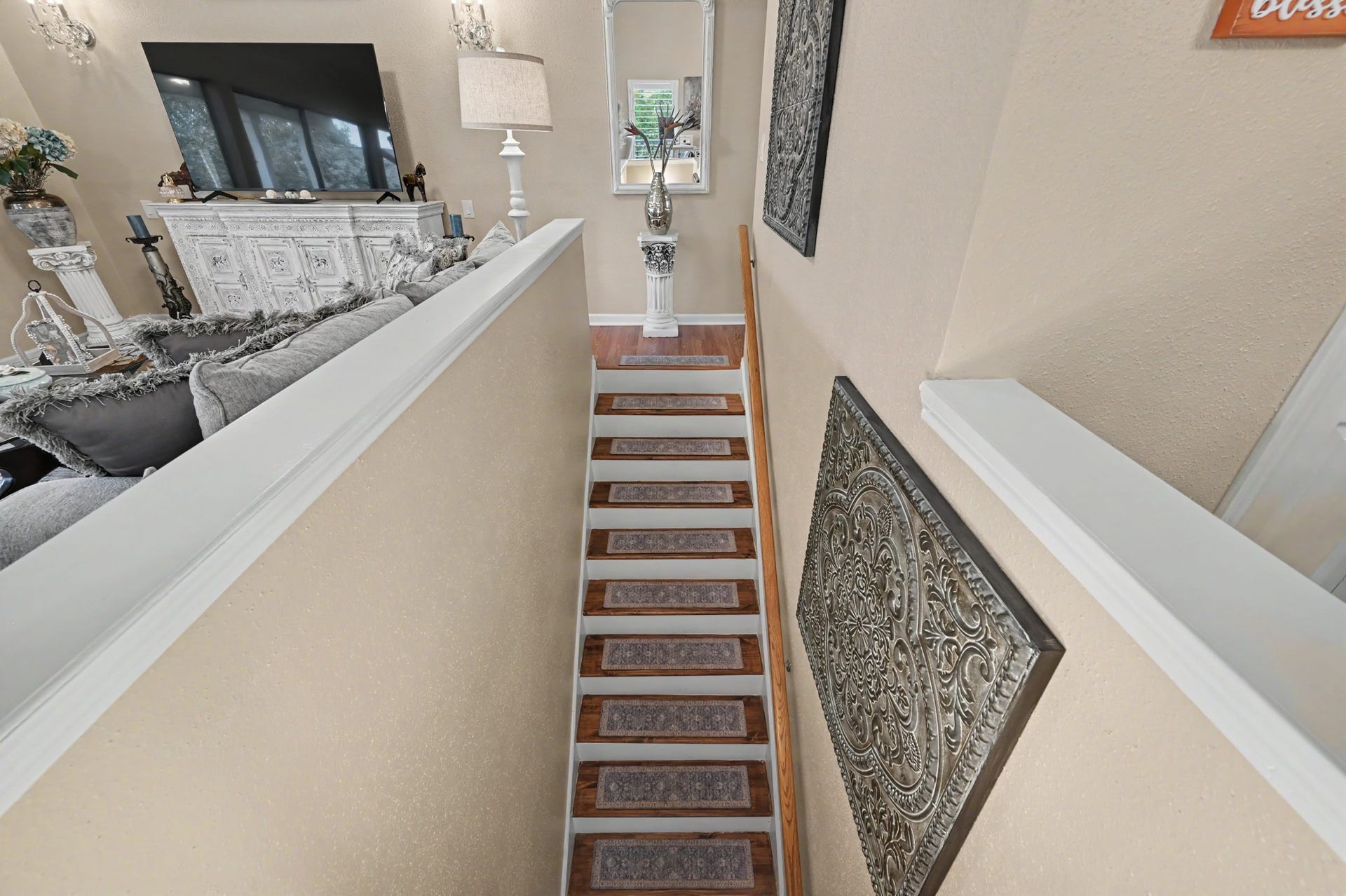As you head upstairs, youll find another full bathroom to your right, along with a convenient storage closet for added functionality.