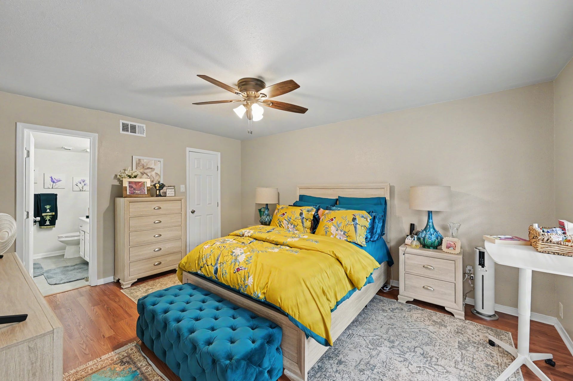 The primary bedroom features a private attached full bathroom and a dedicated closet, creating a comfortable and convenient private retreat.