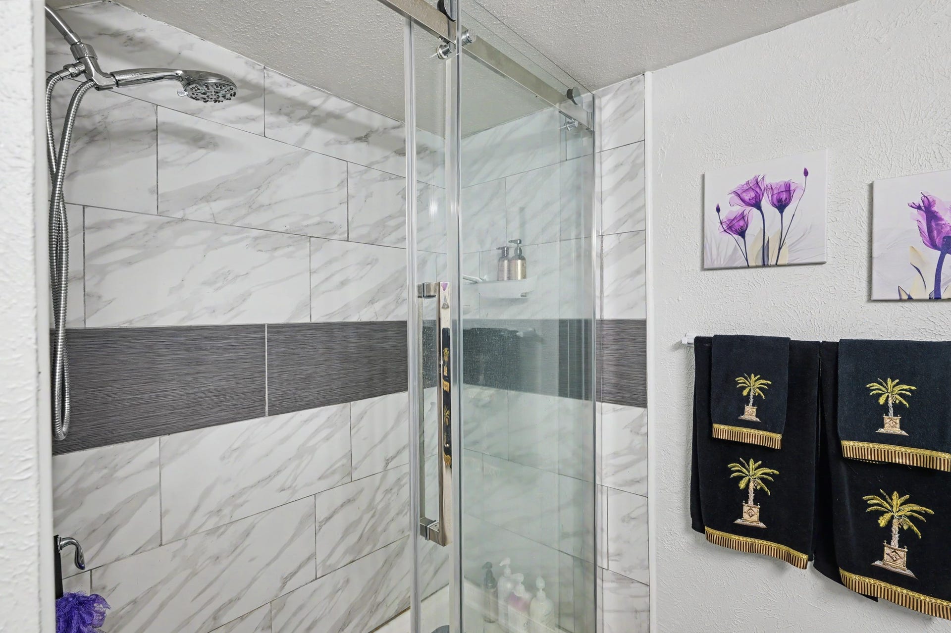 The primary en-suite bathroom offers convenience, style and privacy, located just steps from the bedroom.