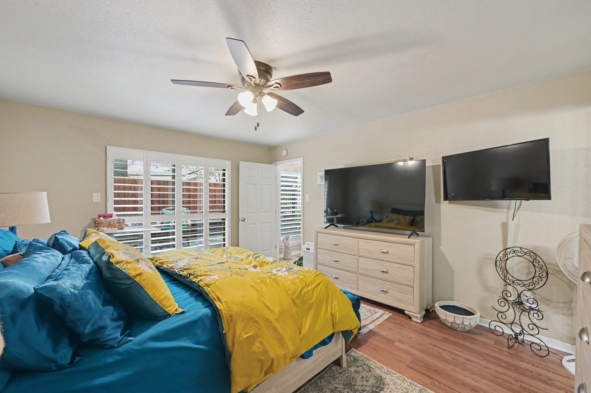 The primary bedroom features a private attached full bathroom and a dedicated closet, creating a comfortable and convenient private retreat.